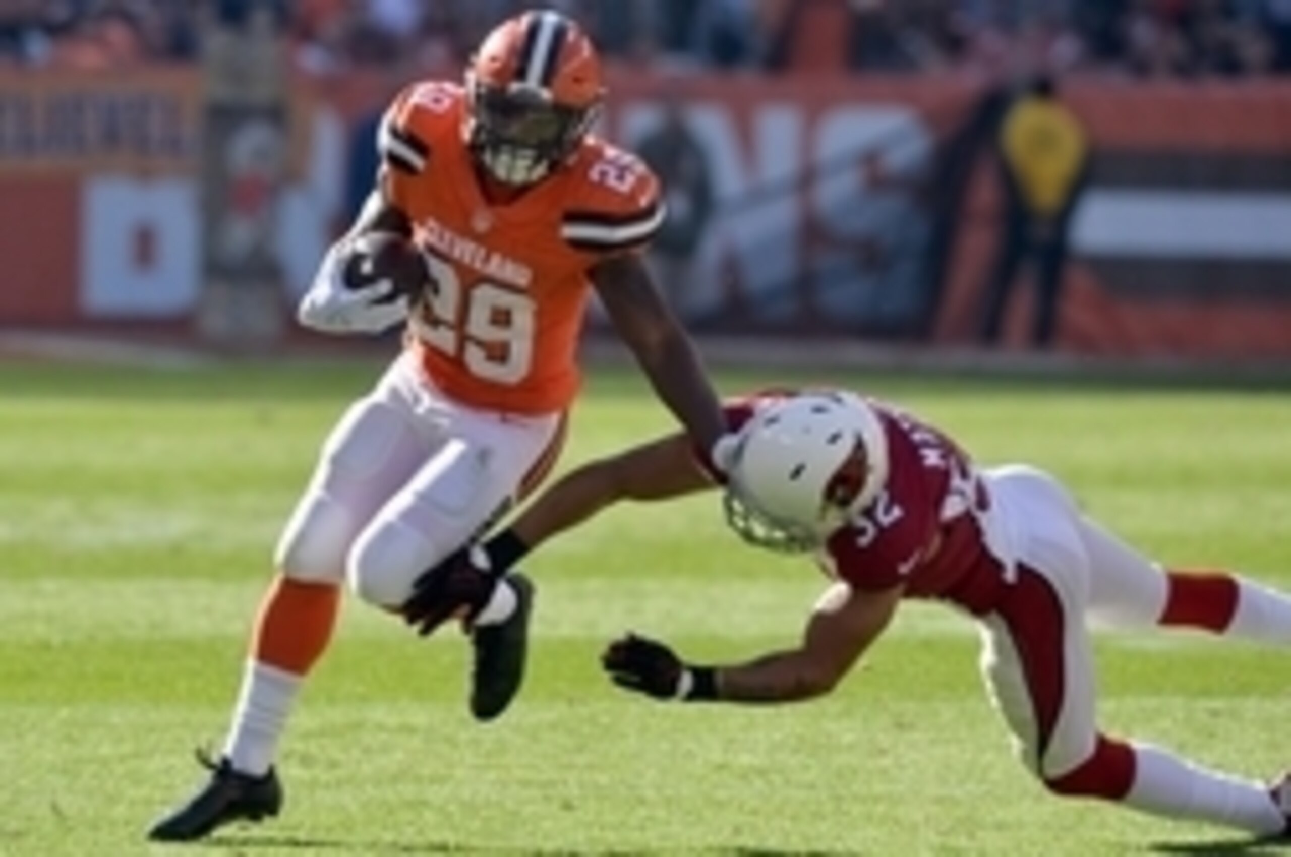 Nov 1, 2015; Cleveland, OH, USA; Cleveland Browns running back Duke Johnson (29) runs past Arizona Cardinals free safety Tyrann Mathieu (32) during the second quarter at FirstEnergy Stadium. Mandatory Credit: Ken Blaze-USA TODAY Sports