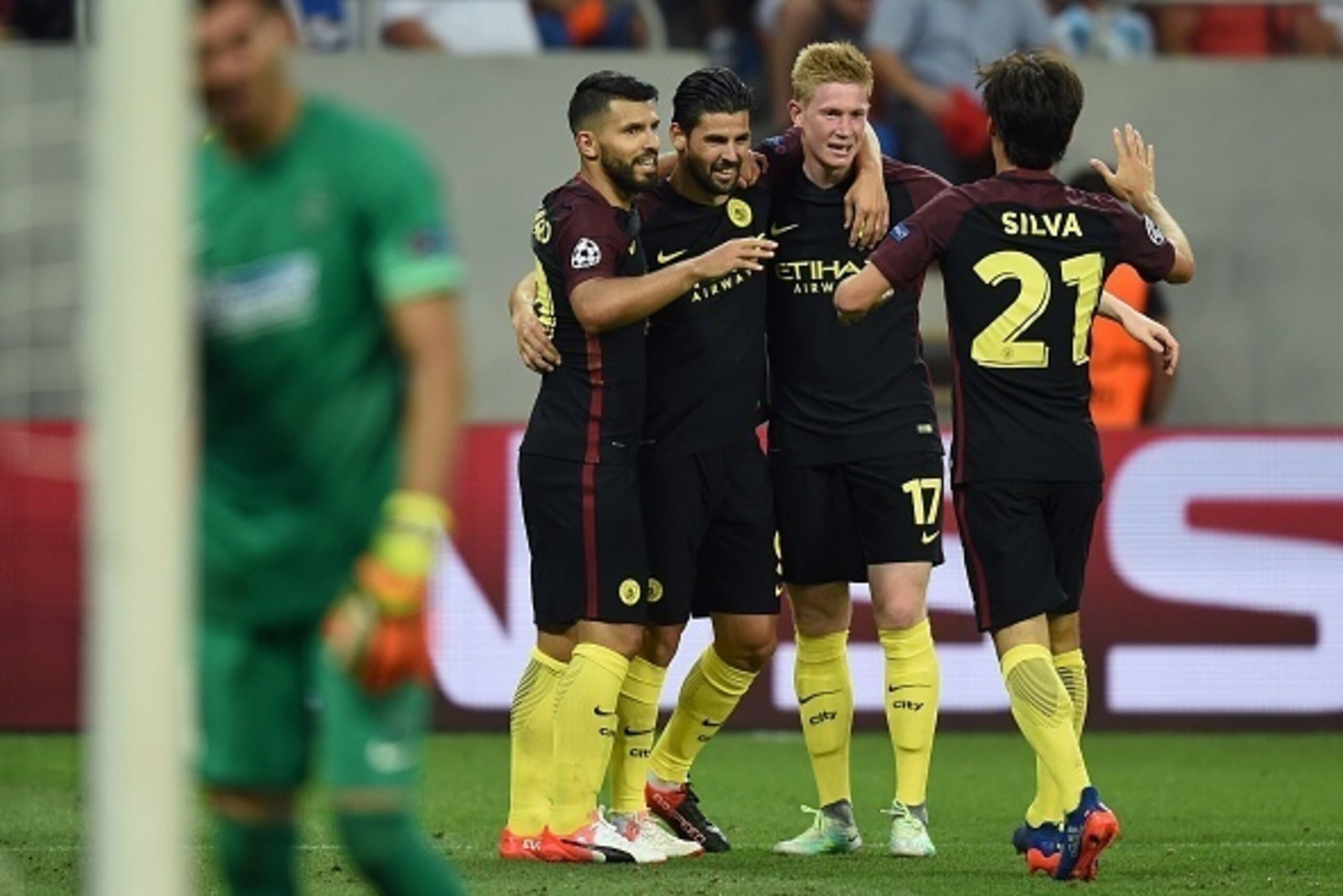 Manchester City's Spanish midfielder Nolito (2L) celebrates with team mates after scoring during the UEFA Champions league first leg play-off football match between Steaua Bucharest and Manchester City at the National Arena stadium in Bucharest on August 
