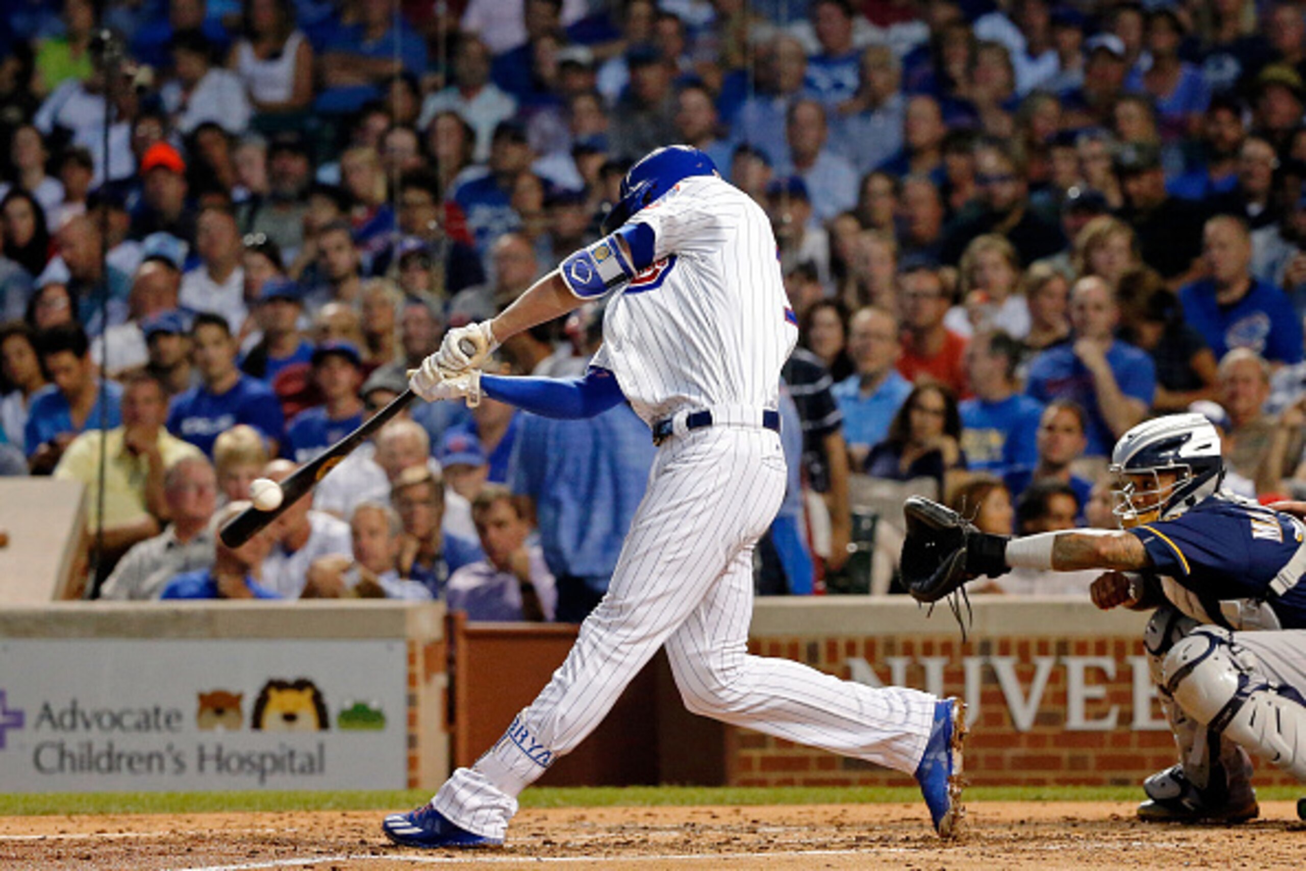 CHICAGO, IL - AUGUST 16: Kris Bryant #17 of the Chicago Cubs hits an RBI single against the Milwaukee Brewers to score David Ross #3 (not pictured) during the third inning in game two of a double header at Wrigley Field on August 16, 2016 in Chicago, Illi