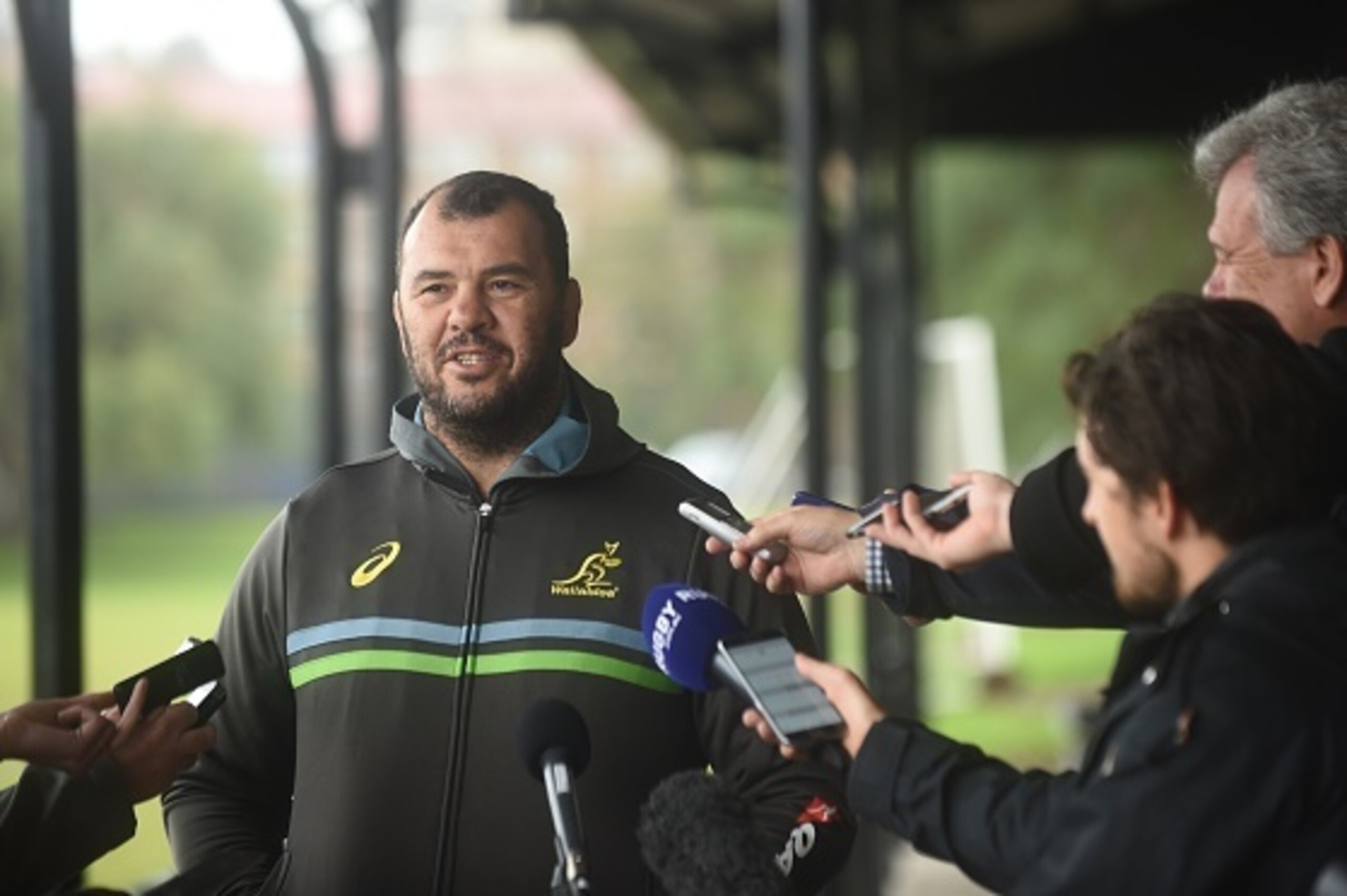 Australian rugby coach Michael Cheika speaks to reporters after a training session in Sydney on August 5, 2016.  
 Coach Michael Cheika named five foreign-based stars and four uncapped players in a 33-man Wallabies squad for the Rugby Championship and Ble