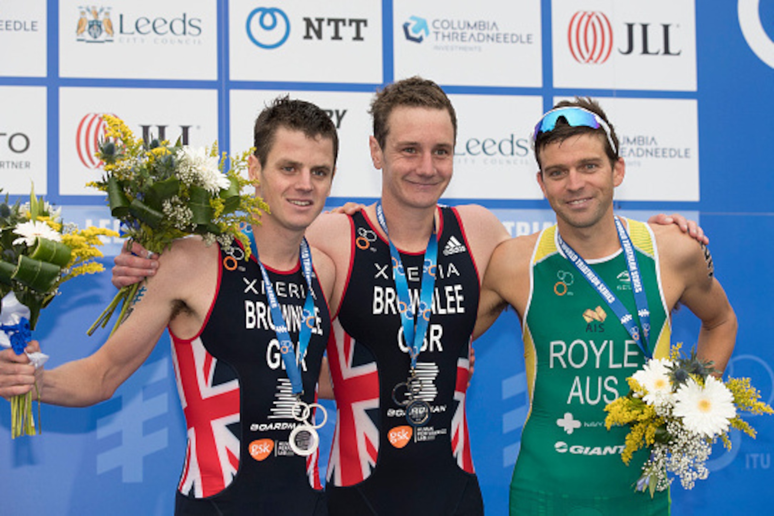 LEEDS, ENGLAND - JUNE 12: Winners of the Mens World Triathlon (L-R) Jonathan Brownlee 2nd place, Alistair Brownlee 1st place and 3rd place Aaron Royle with their medals on June 12, 2016 in Leeds, England. (Photo by Steve Welsh/Getty Images)
