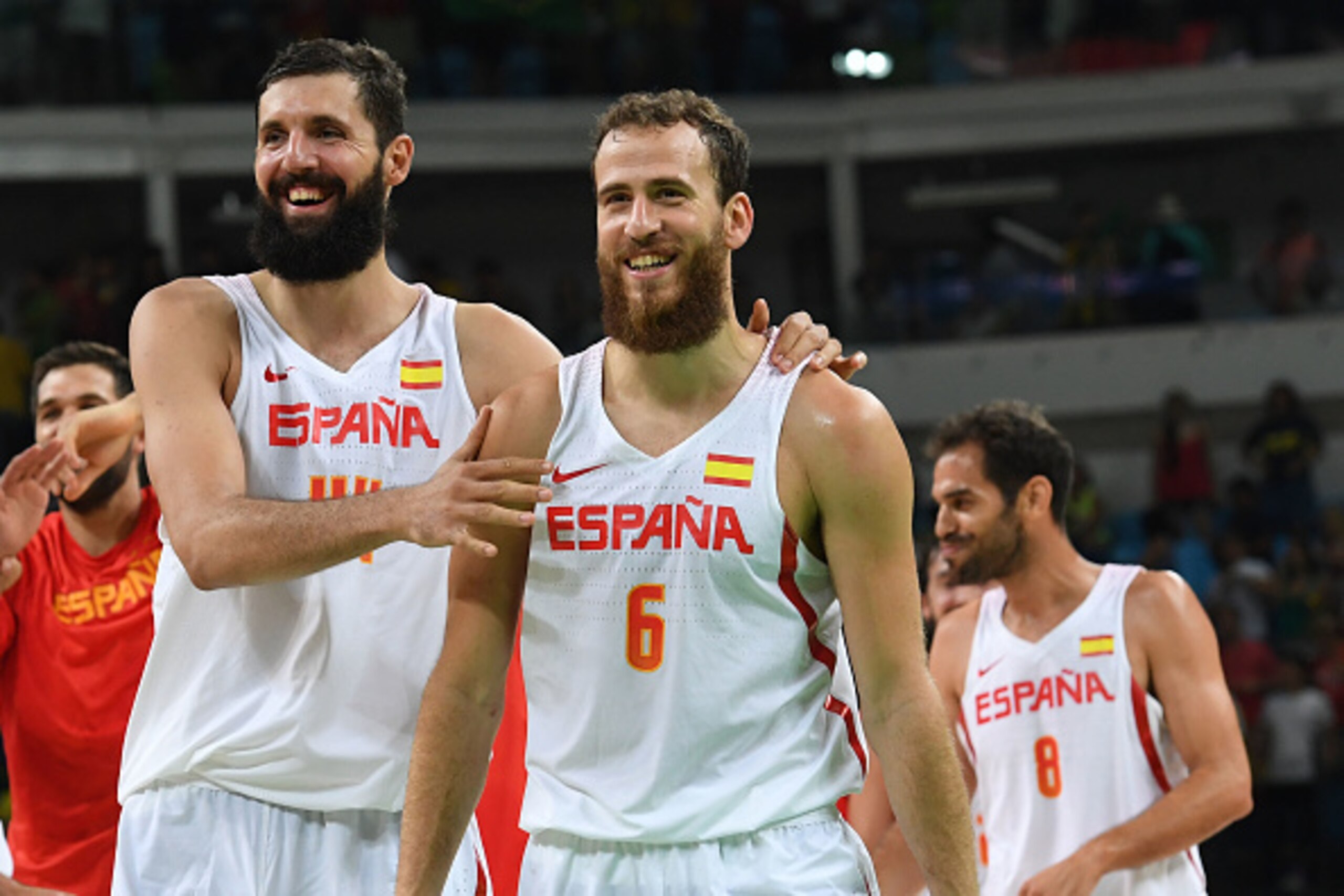 Spain's power forward Nikola Mirotic (L) and Spain's point guard Sergio Rodriguez celebrate after winning the Men's quarterfinal basketball match between Spain and France at the Carioca Arena 1 in Rio de Janeiro on August 17, 2016 during the Rio 2016 Olym