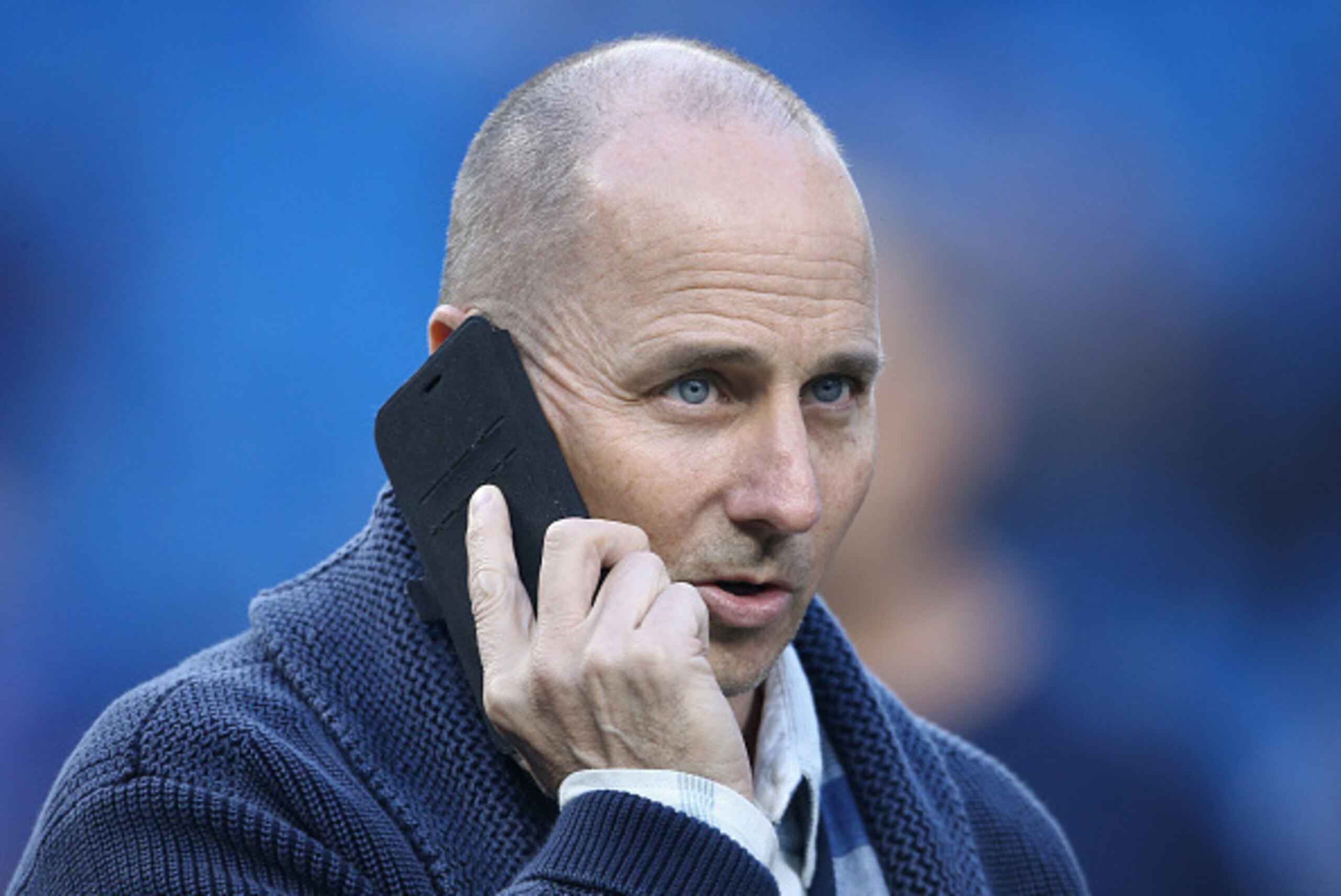 TORONTO, CANADA - SEPTEMBER 21: General manager Brian Cashman of the New York Yankees talks on the phone during batting practice before the start of MLB game action against the Toronto Blue Jays on September 21, 2015 at Rogers Centre in Toronto, Ontario, 