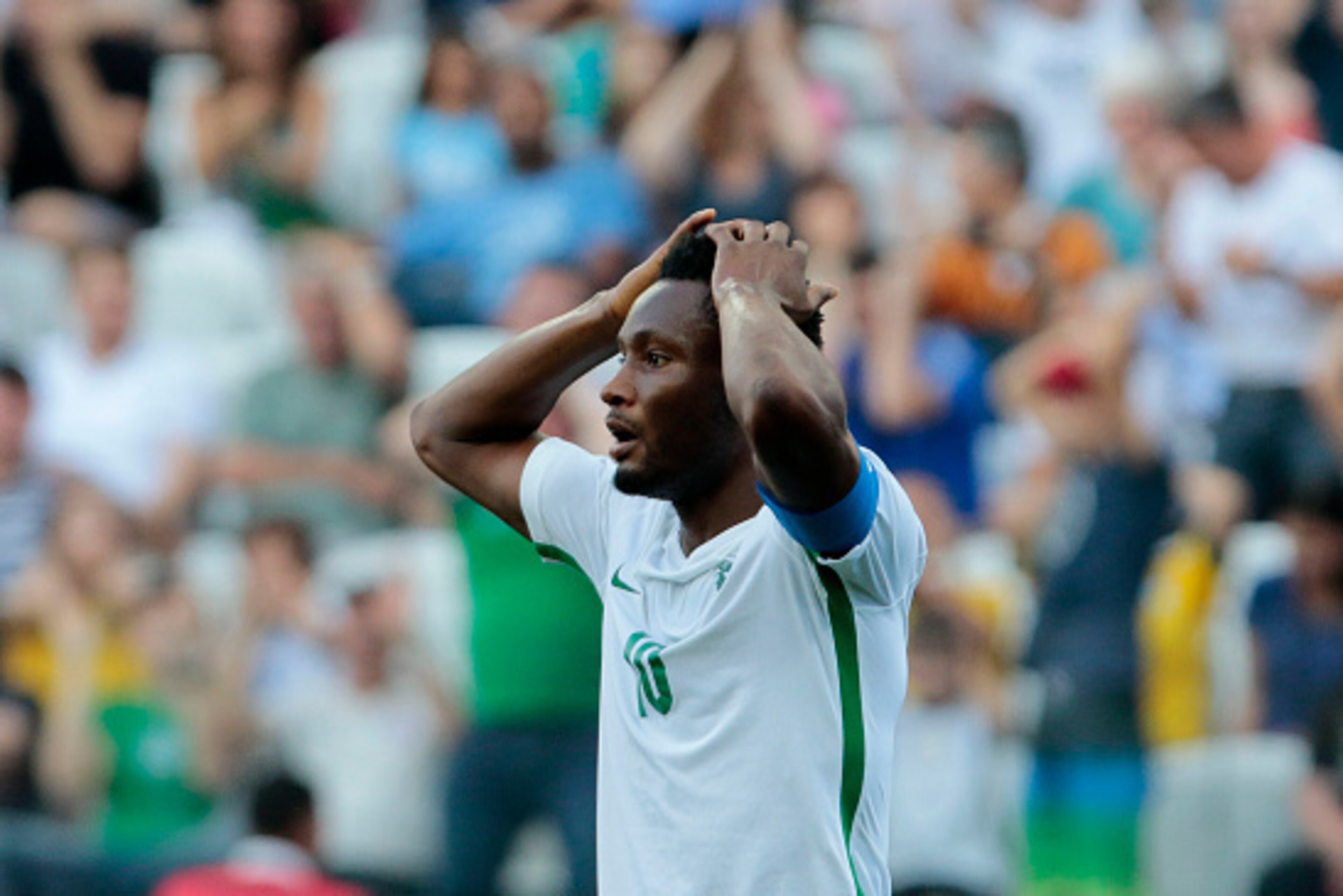 Nigeria's John Obi Mikel reacts during the Rio 2016 Olympic Games men's football semifinal match against Germany at the Corinthains Arena in Sao Paulo, Brazil, on August 17, 2016. / AFP / Miguel SCHINCARIOL        (Photo credit should read MIGUEL SCHINCAR