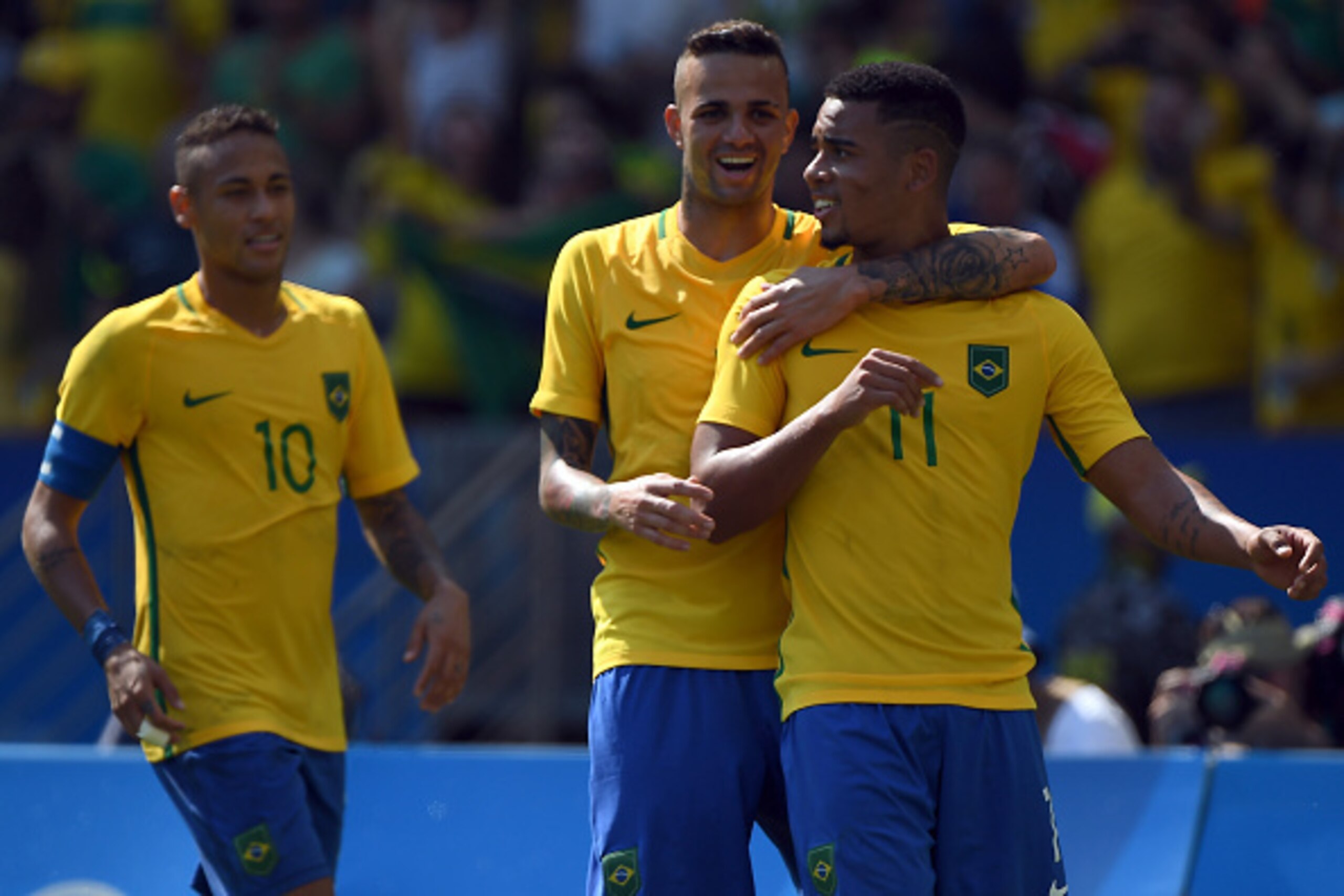 RIO DE JANEIRO, BRAZIL - AUGUST 17:  Gabriel Jesus#11 of Brazil celebrates with Luan and Neymar after scoring during the Men's Semifinal Football match between Brazil and Honduras at Maracana Stadium on Day 12 of the Rio 2016 Olympic Games on August 17, 2