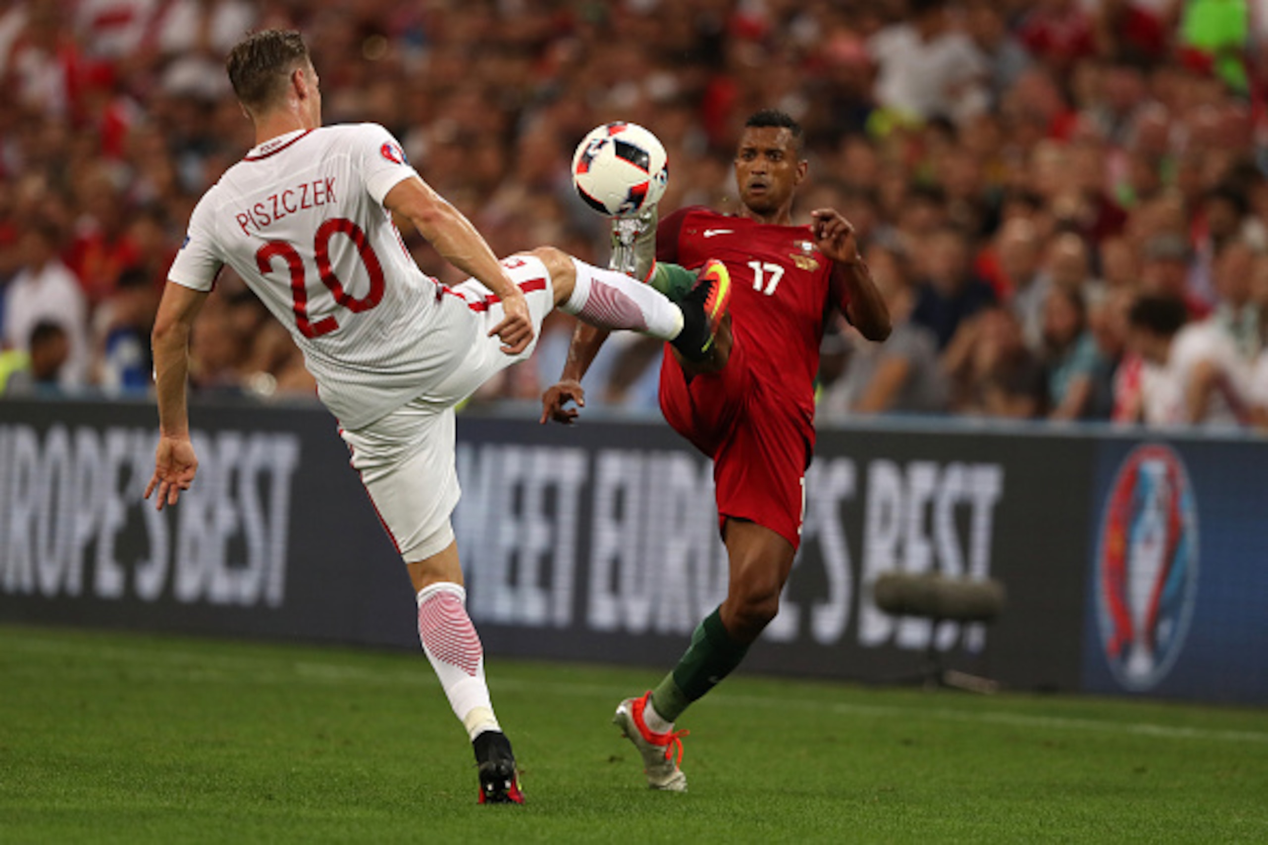 MARSEILLE, FRANCE - JUNE 30: Lukasz Piszczek of Poland and Nani of Portugal during the UEFA Euro 2016 quarter final match between Poland and Portugal at Stade Velodrome on June 30, 2016 in Marseille, France. (Photo by Matthew Ashton - AMA/Getty Images) MARSEILLE, FRANCE - JUNE 30: Lukasz Piszczek of Poland and Nani of Portugal during the UEFA Euro 2016 quarter final match between Poland and Portugal at Stade Velodrome on June 30, 2016 in Marseille, France. (Photo by Matthew Ashton - AMA/Getty Images)