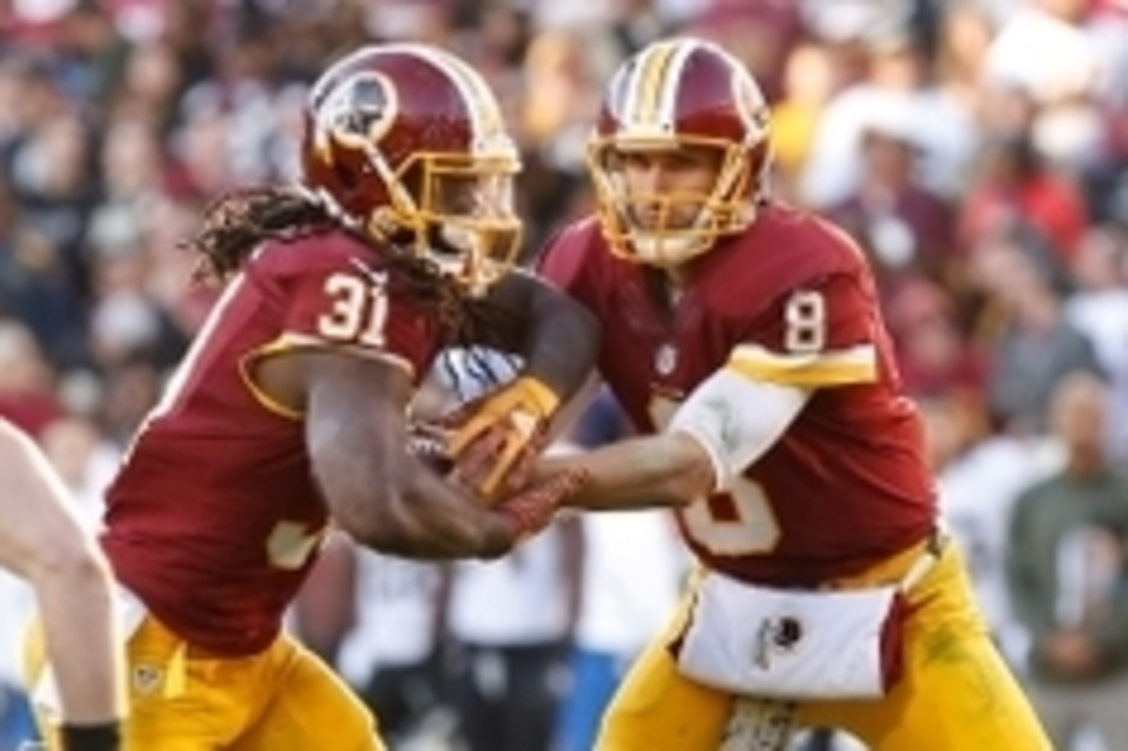 Nov 15, 2015; Landover, MD, USA; Washington Redskins quarterback Kirk Cousins (8) hands the ball off to Redskins running back Matt Jones (31) against the New Orleans Saints at FedEx Field. Mandatory Credit: Geoff Burke-USA TODAY Sports