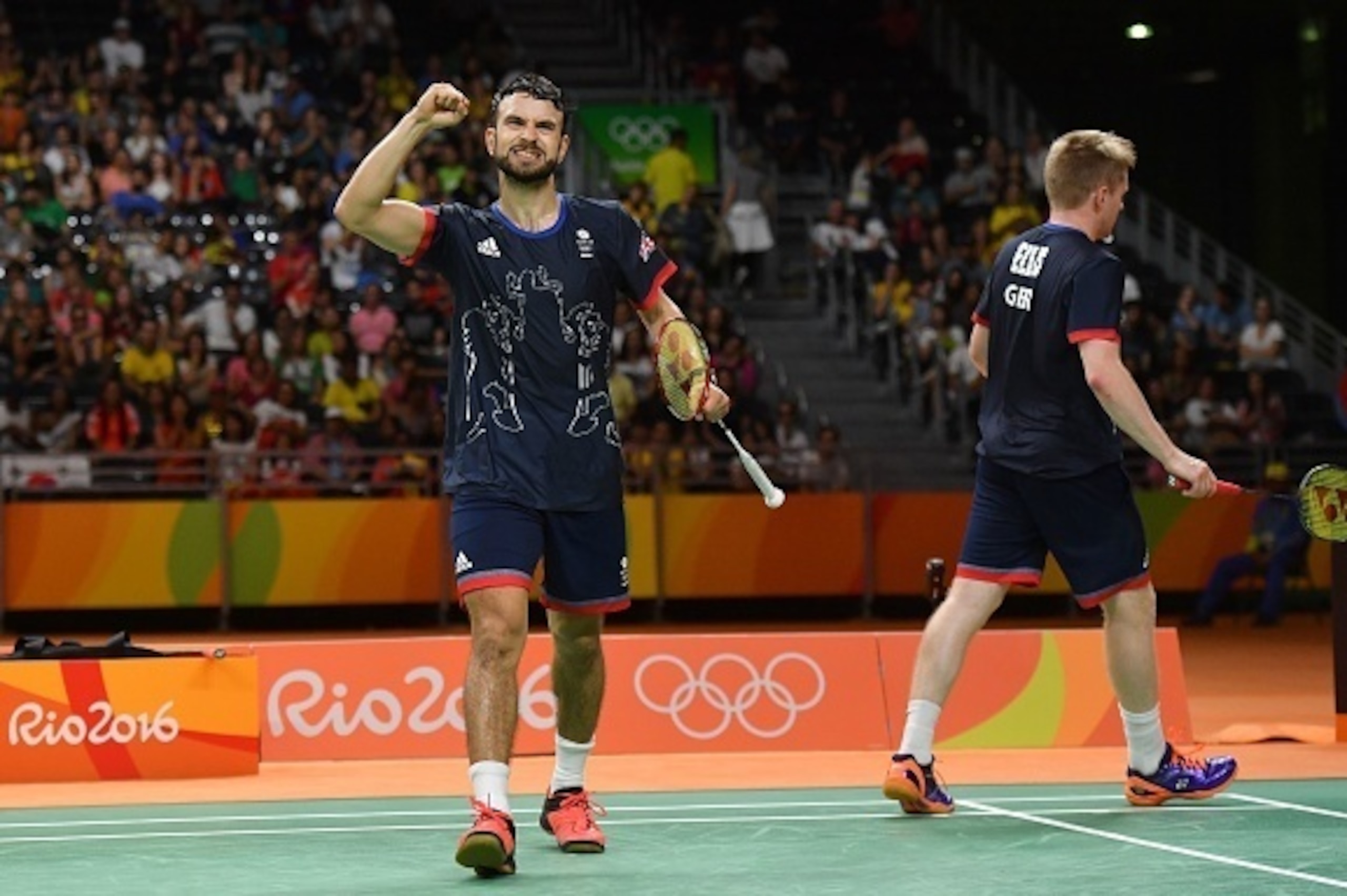 Great Britain's Marcus Ellis (R) and Great Britain's Chris Langridge celebrate after winning a point against China's Chai Biao and China's Hong Wei during their men's doubles Bronze Medal badminton match at the Riocentro stadium in Rio de Janeiro on Augus