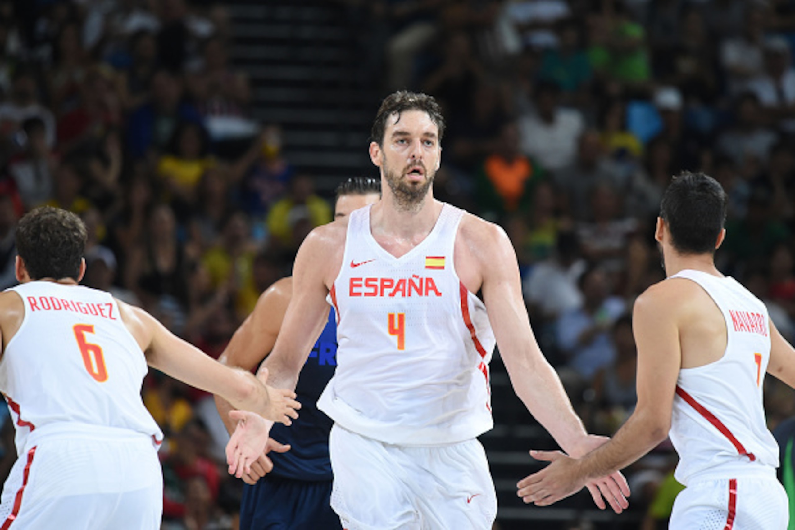 Spain's centre Pau Gasol (C) celebrates a point with Spain's point guard Sergio Rodriguez (L) and Spain's guard Juan-Carlos Navarro during a Men's quarterfinal basketball match between Spain and France at the Carioca Arena 1 in Rio de Janeiro on August 17