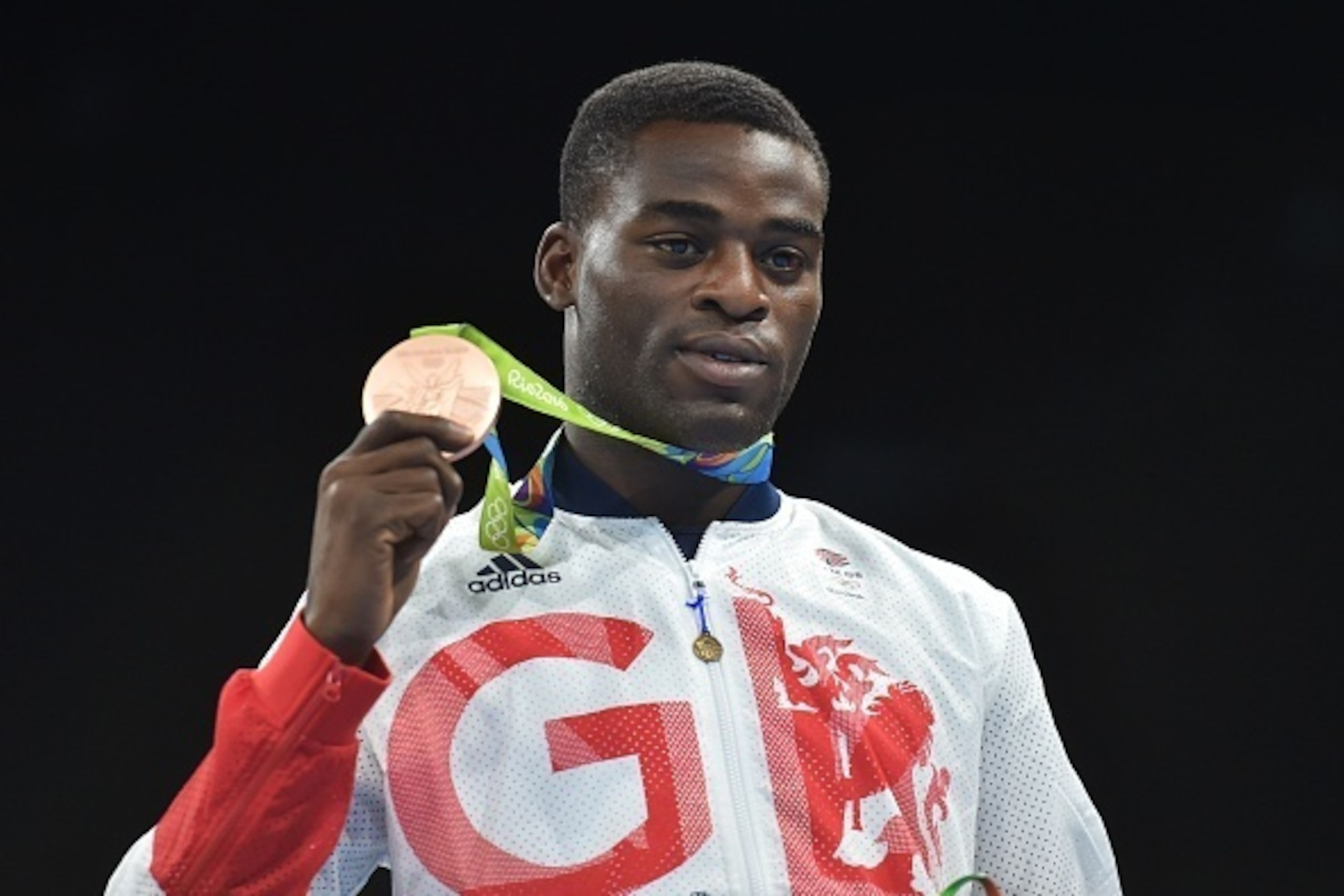 Great Britain's Joshua Buatsi poses on the podium with a medal at the Rio 2016 Olympic Games at the Riocentro - Pavilion 6 in Rio de Janeiro on August 18, 2016.  
Three-time amateur world champion Julio Cesar La Cruz beat Kazakhstan's Adilbek Niyazymbetov