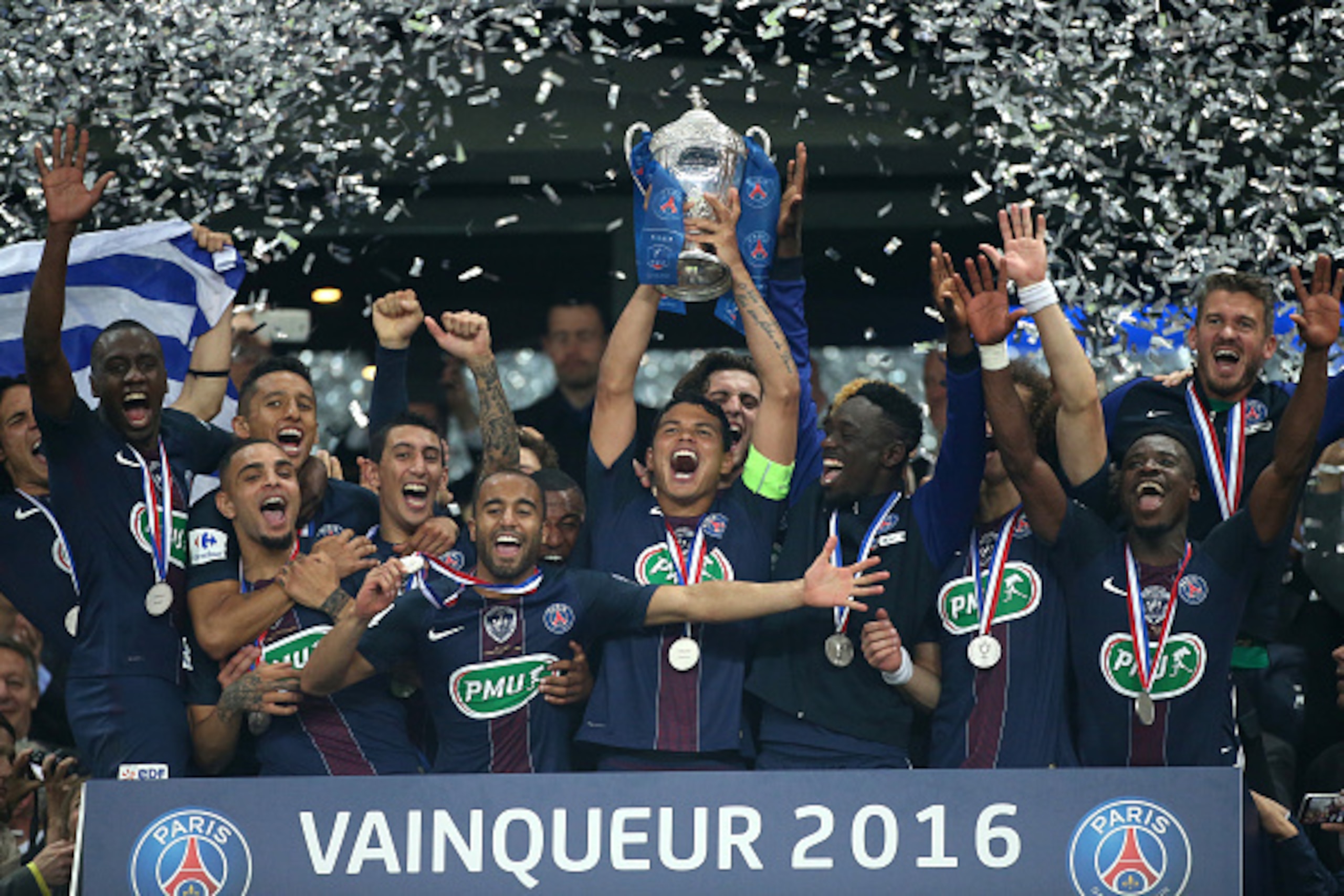 PARIS, FRANCE - MAY 21: Thiago Silva of PSG holds the French Cup surrounded by teammates Blaise Matuidi, Layvin Kurzawa, Marquinhos, Angel Di Maria, Lucas Moura, Jean-Kevin Augustin, Serge Aurier, Nicolas Douchez during the trophy ceremony following the F