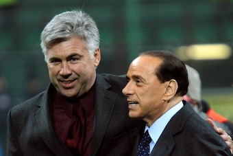AC Milan's president Silvio Berlusconi poses with AC Milan's coach Carlo Ancelotti after Berlusconi trophy between Juventus and AC Milan at San Siro Stadium in Milan, 06 January  2006. AC Milan beat Juventus 3-2. AFP PHOTO / GIUSEPPE CACACE (Photo credit 