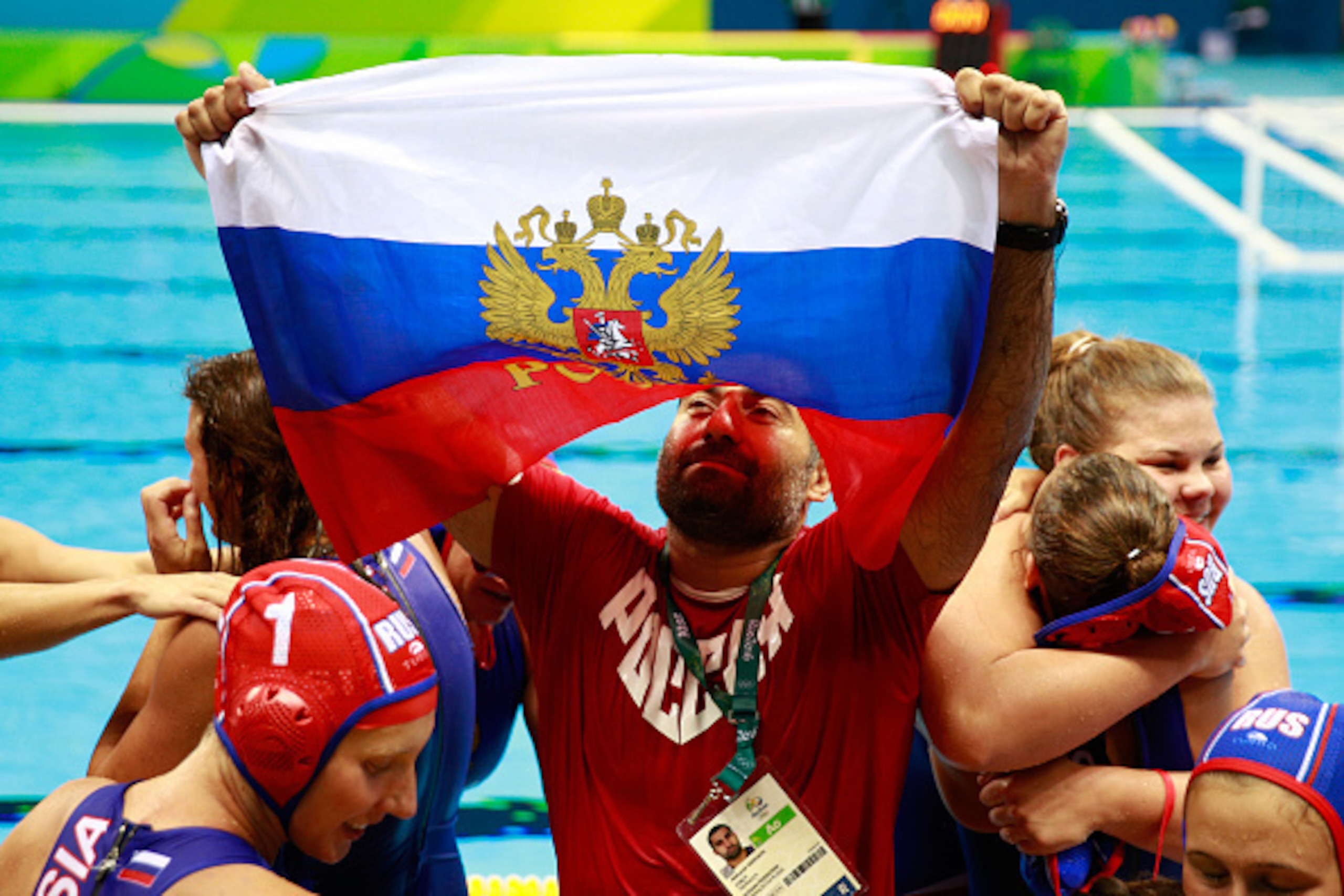 RIO DE JANEIRO, BRAZIL - AUGUST 19:  Alexander Gaidukov the head coach of Russia celebrates with his players after winning bronze during the Women's Water Polo Bronze Medal match between Hungary and Russia on Day 14 of the Rio 2016 Olympic Games at the Ol