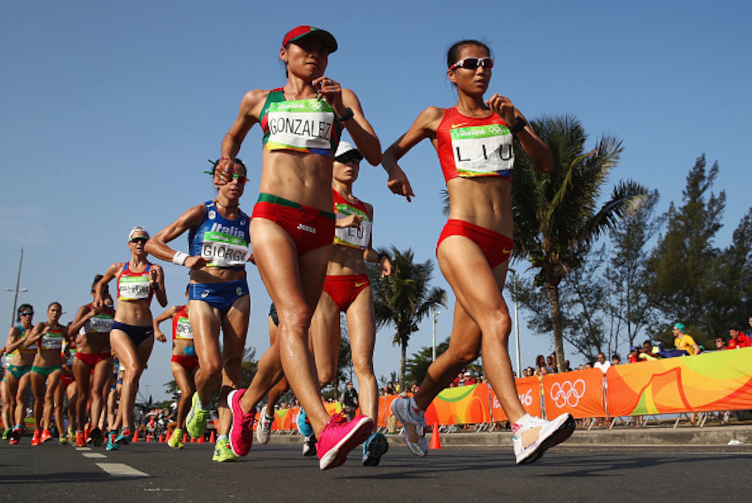 RIO DE JANEIRO, BRAZIL - AUGUST 19:  Maria Guadalupe Gonzalez of Mexico and Hong Liu of China lead the group as they compete in the Women's 20km Walk final on Day 14 of the Rio 2016 Olympic Games at Pontal on August 19, 2016 in Rio de Janeiro, Brazil.  (P
