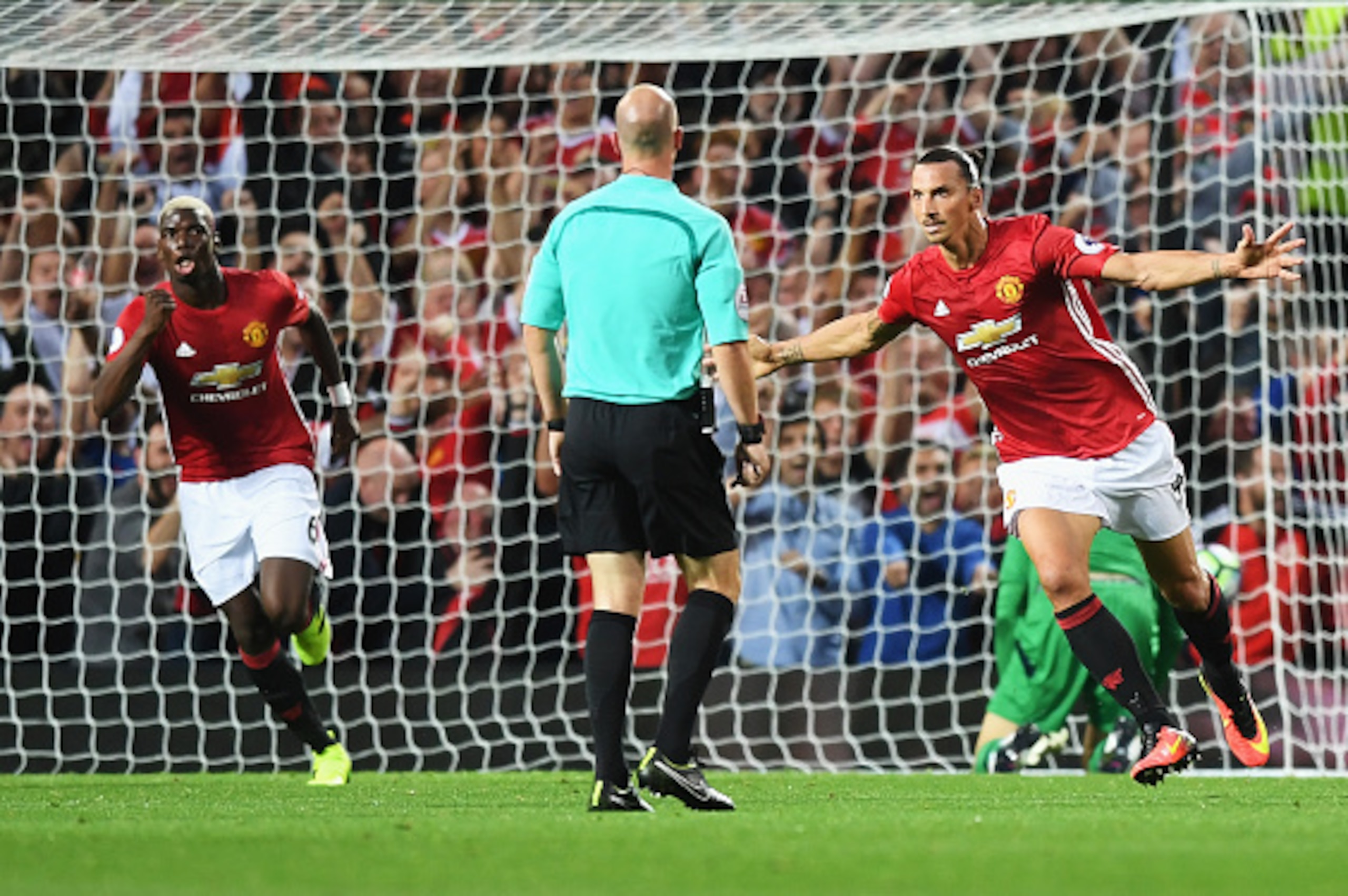 MANCHESTER, ENGLAND - AUGUST 19: Zlatan Ibrahimovic of Manchester United celebrates scoring the opening goal with Paul Pogba during the Premier League match between Manchester United and Southampton at Old Trafford on August 19, 2016 in Manchester, Engla MANCHESTER, ENGLAND - AUGUST 19: Zlatan Ibrahimovic of Manchester United celebrates scoring the opening goal with Paul Pogba during the Premier League match between Manchester United and Southampton at Old Trafford on August 19, 2016 in Manchester, Engla