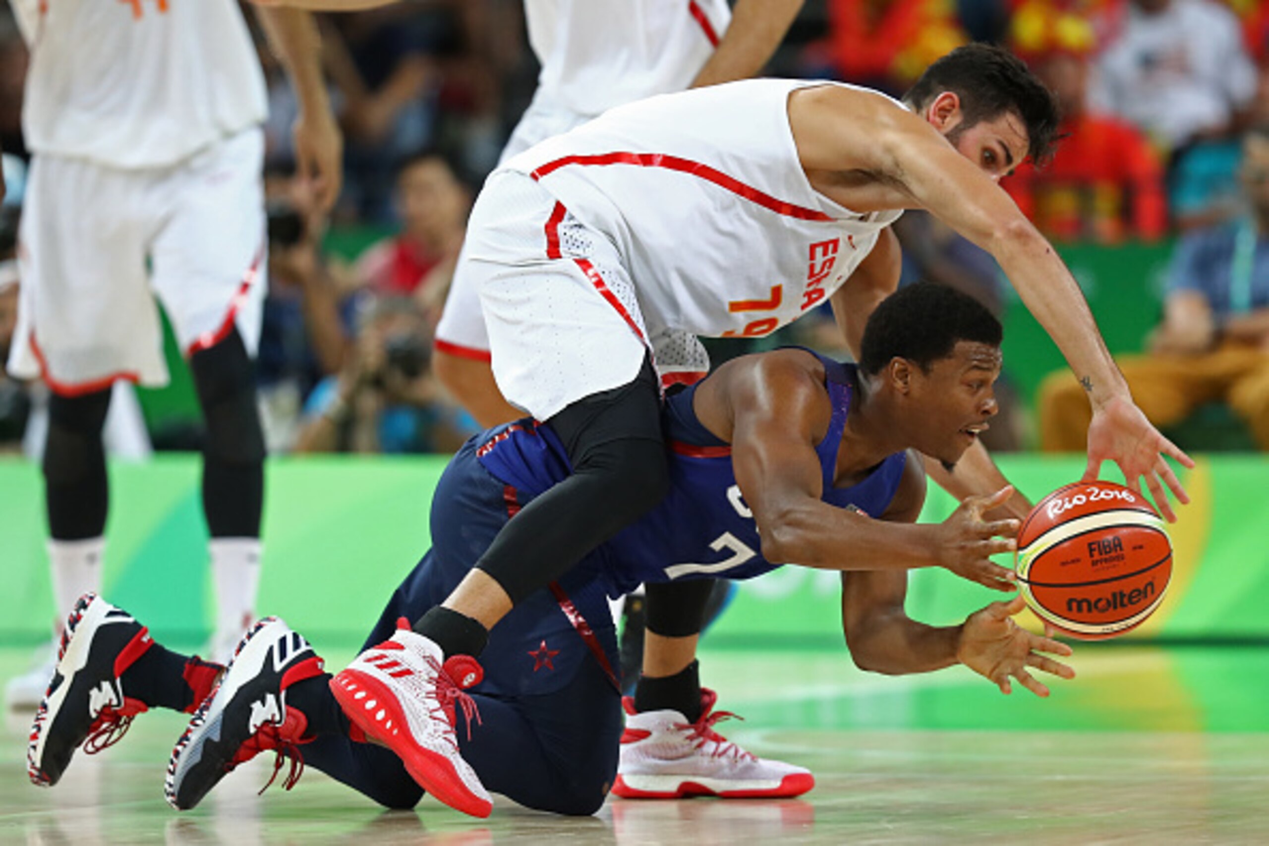 RIO DE JANEIRO, BRAZIL - AUGUST 19: Kyle Lowry #7 of United States battles for the ball against Ricky Rubio #79 of Spain during the Men's Semifinal match on Day 14 of the Rio 2016 Olympic Games at Carioca Arena 1 on August 19, 2016 in Rio de Janeiro, Braz