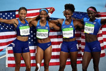 RIO DE JANEIRO, BRAZIL - AUGUST 19:  English Gardner, Allyson Felix, Tianna Bartoletta and Tori Bowie of the United States celebrate winning gold in the Women's 4 x 100m Relay Final on Day 14 of the Rio 2016 Olympic Games at the Olympic Stadium on August 
