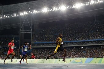 Jamaica's Usain Bolt crosses the finish line to gives Jamaica the victory in the Men's 4x100m Relay Final during the athletics event at the Rio 2016 Olympic Games at the Olympic Stadium in Rio de Janeiro on August 19, 2016.   / AFP / Adrian DENNIS        