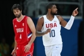 Aug 12, 2016; Rio de Janeiro, Brazil; United States guard Kyrie Irving (10) reacts with Serbia point guard Milos Teodosic (4) during the game in the preliminary round of the Rio 2016 Summer Olympic Games at Carioca Arena 1. Mandatory Credit: Jason Getz-US