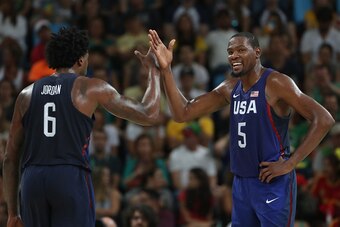 RIO DE JANEIRO, BRAZIL - AUGUST 19:  DeAndre Jordan #6 and Kevin Durant #5 of United States celebrate a play against Spain during the Men's Semifinal match on Day 14 of the Rio 2016 Olympic Games at Carioca Arena 1 on August 19, 2016 in Rio de Janeiro, Br