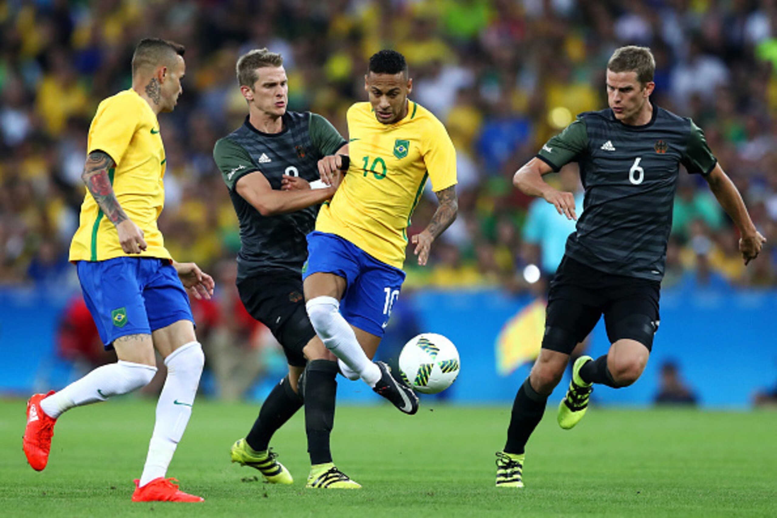RIO DE JANEIRO, BRAZIL - AUGUST 20:  Neymar (C) of Brazil is challenged by Lars Bender (L) of Germany and Sven Bender (R) of Germany during the Men's Football Final between Brazil and Germany at the Maracana Stadium on Day 15 of the Rio 2016 Olympic Games
