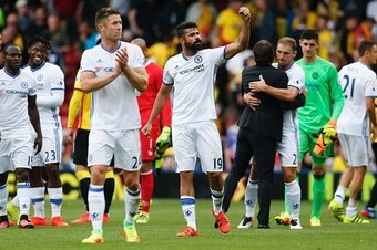 Chelsea's Brazilian-born Spanish striker Diego Costa (C) raises a fist after the final whistle as he celebrates victory in the English Premier League football match between Watford and Chelsea at Vicarage Road Stadium in Watford, north of London on August