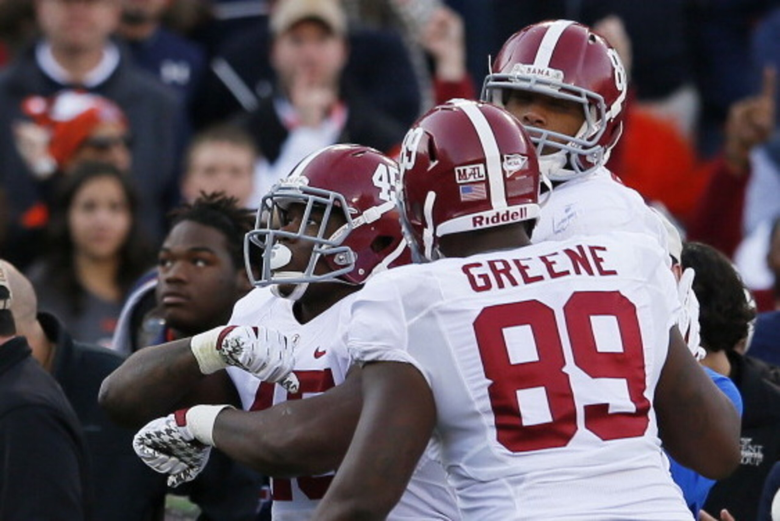 AUBURN, AL - NOVEMBER 30:  Jalston Fowler #45, O.J. Howard #88 and Brandon Greene #89 of the Alabama Crimson Tide celebrate Fowler's second quarter touchdown against the Auburn Tigers at Jordan-Hare Stadium on November 30, 2013 in Auburn, Alabama.  (Photo