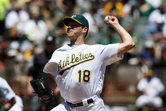 OAKLAND, CA - JULY 17:  Rich Hill #18 of the Oakland Athletics pitches against the Toronto Blue Jays during the first inning at the Oakland Coliseum on July 17, 2016 in Oakland, California. (Photo by Jason O. Watson/Getty Images)