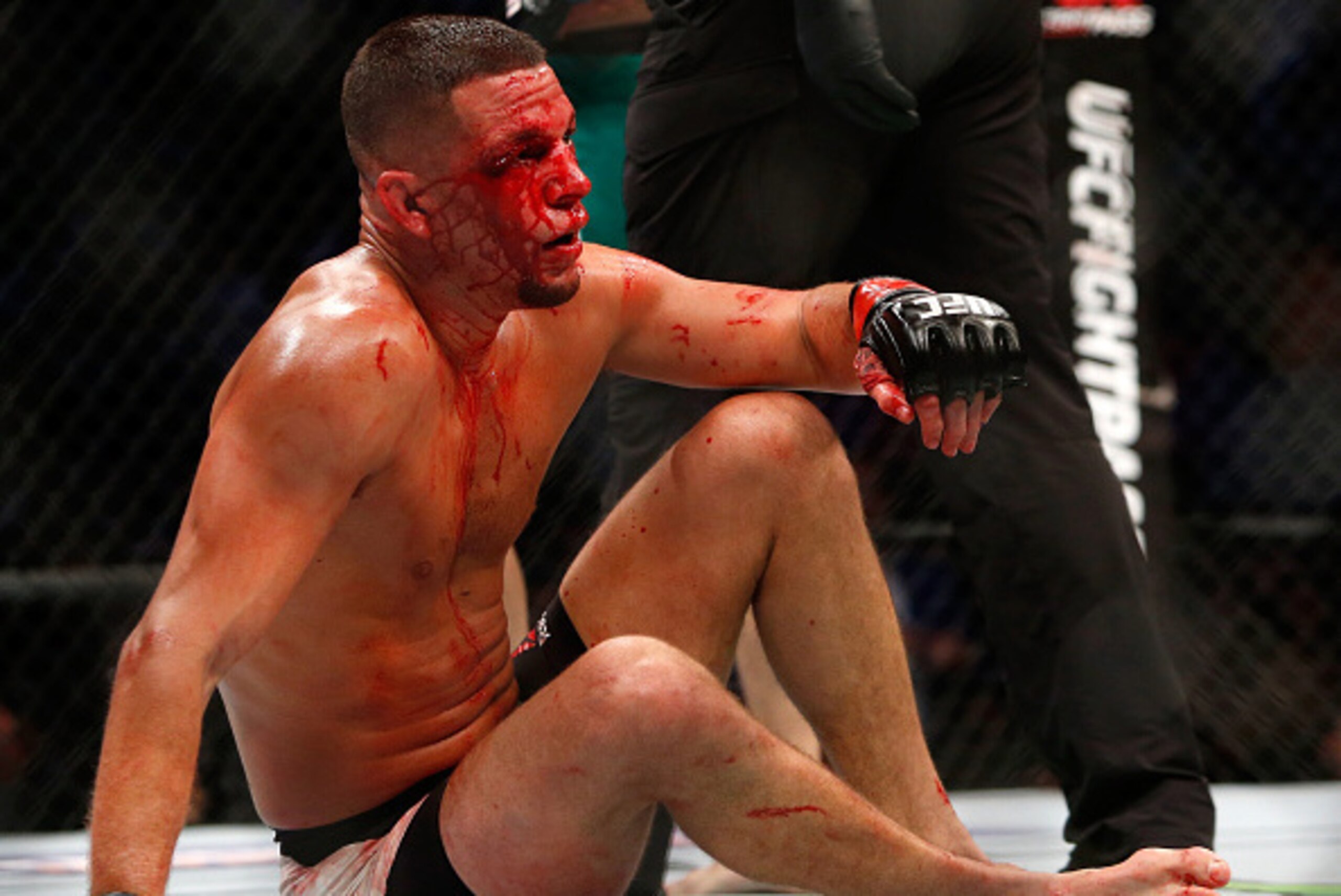LAS VEGAS, NV - AUGUST 20: Nate Diaz gets up from the canvas during his welterweight rematch against Conor McGregor at the UFC 202 event at T-Mobile Arena on August 20, 2016 in Las Vegas, Nevada. McGregor won by majority decision. (Photo by Steve Marcus LAS VEGAS, NV - AUGUST 20: Nate Diaz gets up from the canvas during his welterweight rematch against Conor McGregor at the UFC 202 event at T-Mobile Arena on August 20, 2016 in Las Vegas, Nevada. McGregor won by majority decision. (Photo by Steve Marcus