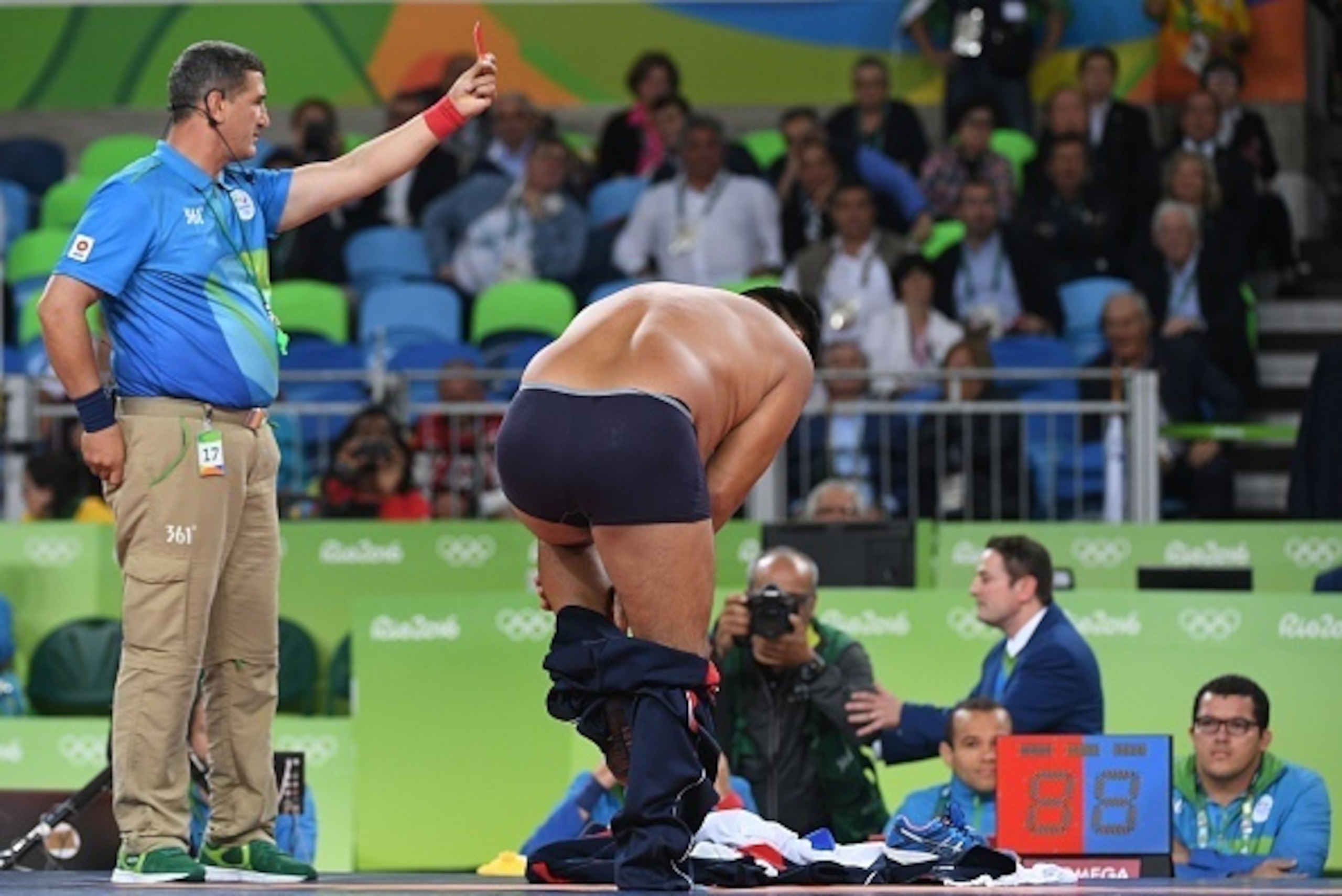 Mongolia's Mandakhnaran Ganzorig's coach reacts after the judges announced that Uzbekistan's Ikhtiyor Navruzov won folling a video replay in their men's 65kg freestyle bronze medal match on August 21, 2016, during the wrestling event of the Rio 2016 Olymp