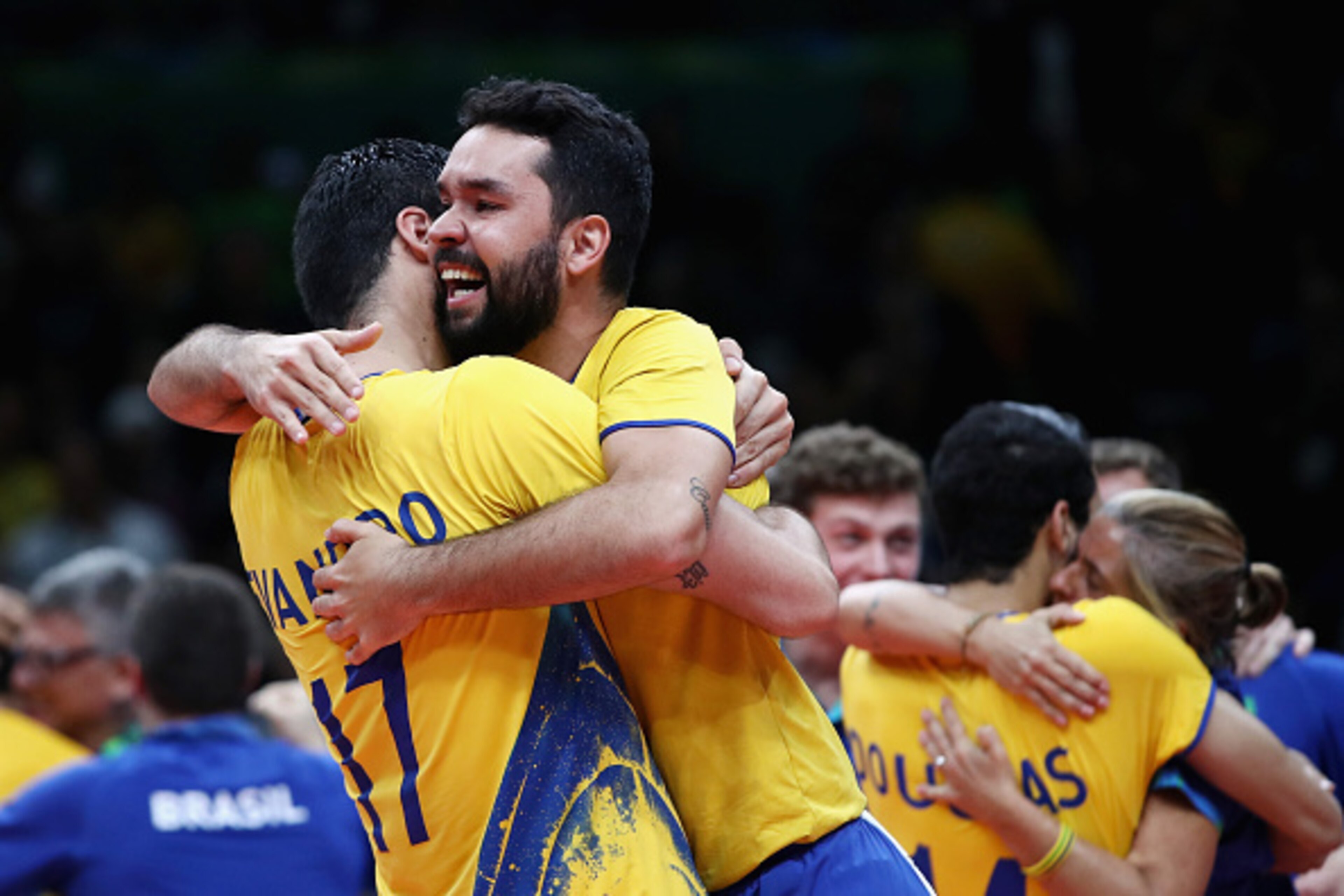 RIO DE JANEIRO, BRAZIL - AUGUST 21:  Brazil celebrates after winning the Men's Gold Medal Match between Italy and Brazil on Day 16 of the Rio 2016 Olympic Games at Maracanazinho on August 21, 2016 in Rio de Janeiro, Brazil.  (Photo by Mark Kolbe/Getty Ima