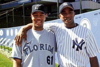 BRONX, NY:  Orlando Hernandez of the New York Yankees poses with his half brother Livan Hernandez of the Florida Marlins at Yankee Stadium in the Bronx, New York.  Orlando 'El Duque' Hernandez played for the New York Yankees from 1998-02 returning 2004.  