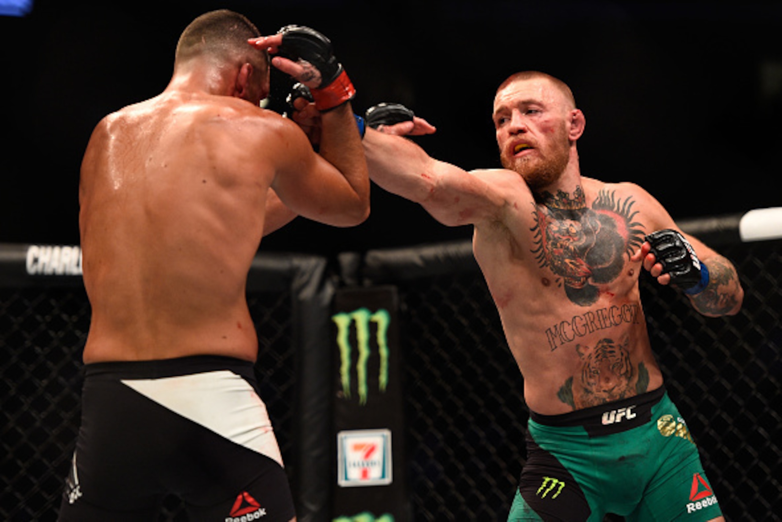 LAS VEGAS, NV - AUGUST 20:  (R-L) Conor McGregor of Ireland punches Nate Diaz in their welterweight bout during the UFC 202 event at T-Mobile Arena on August 20, 2016 in Las Vegas, Nevada. (Photo by Jeff Bottari/Zuffa LLC/Zuffa LLC via Getty Images)