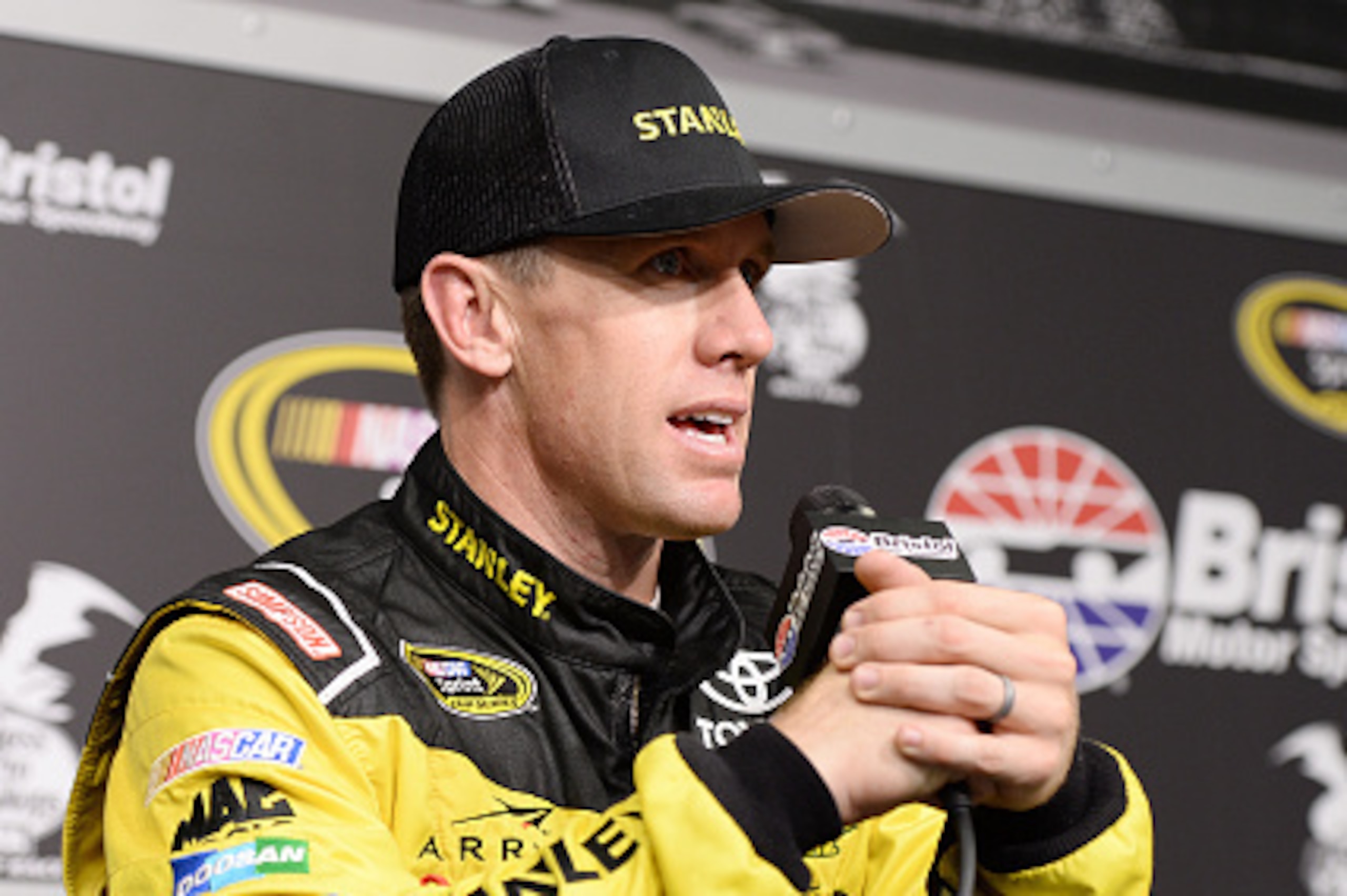 BRISTOL, TN - AUGUST 19: Carl Edwards, driver of the #19 Stanley Toyota, speaks in a press conference during practice for the NASCAR Sprint Cup Series Bass Pro Shops NRA Night Race at Bristol Motor Speedway on August 19, 2016 in Bristol, Tennessee. (Pho BRISTOL, TN - AUGUST 19: Carl Edwards, driver of the #19 Stanley Toyota, speaks in a press conference during practice for the NASCAR Sprint Cup Series Bass Pro Shops NRA Night Race at Bristol Motor Speedway on August 19, 2016 in Bristol, Tennessee. (Pho