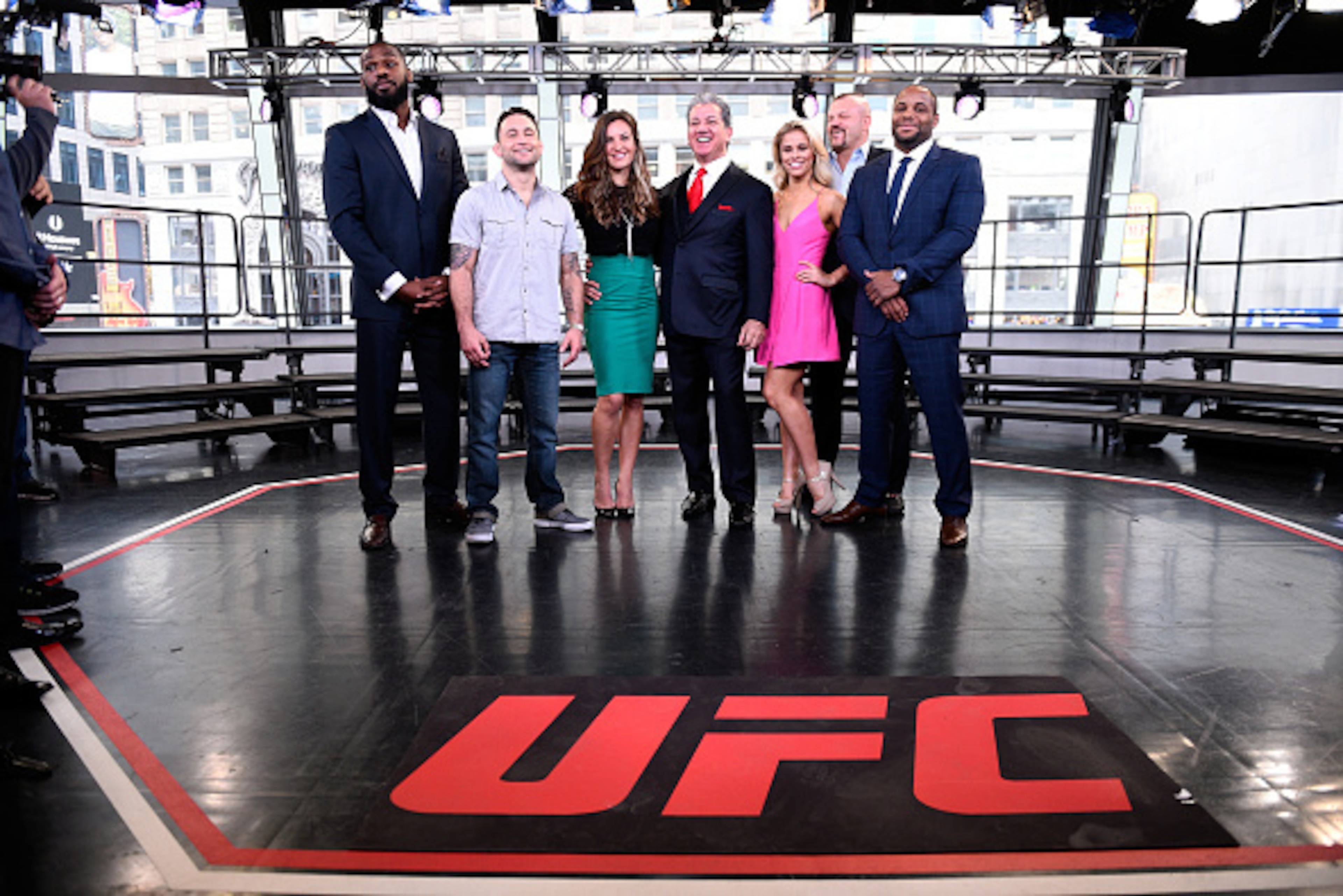 NEW YORK, NY - APRIL 27:  (L-R) Jon Jones, Frankie Edgar, Miesha Tate, Bruce Buffer, Paige VanZant, Chuck Liddell and Daniel Cormier pose onstage during the UFC 200 'Good Morning America' taping at the ABC Times Square Studios on April 27, 2016 in New Yor