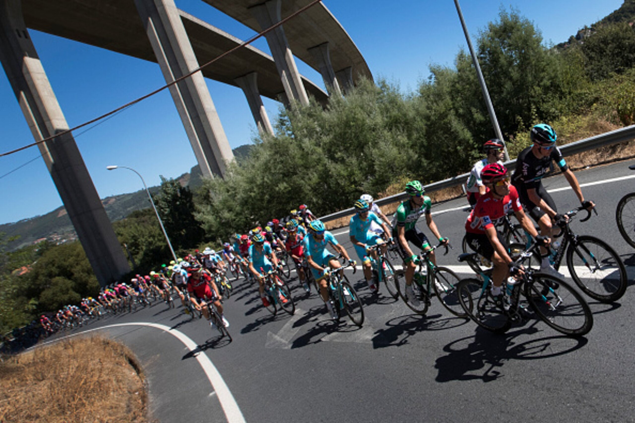 Cyclsits compete during the second stage of the 71st edition of 'La Vuelta' Tour of Spain, a 159km route between Ourense and Baiona on August 21, 2016. / AFP / JAIME REINA        (Photo credit should read JAIME REINA/AFP/Getty Images)