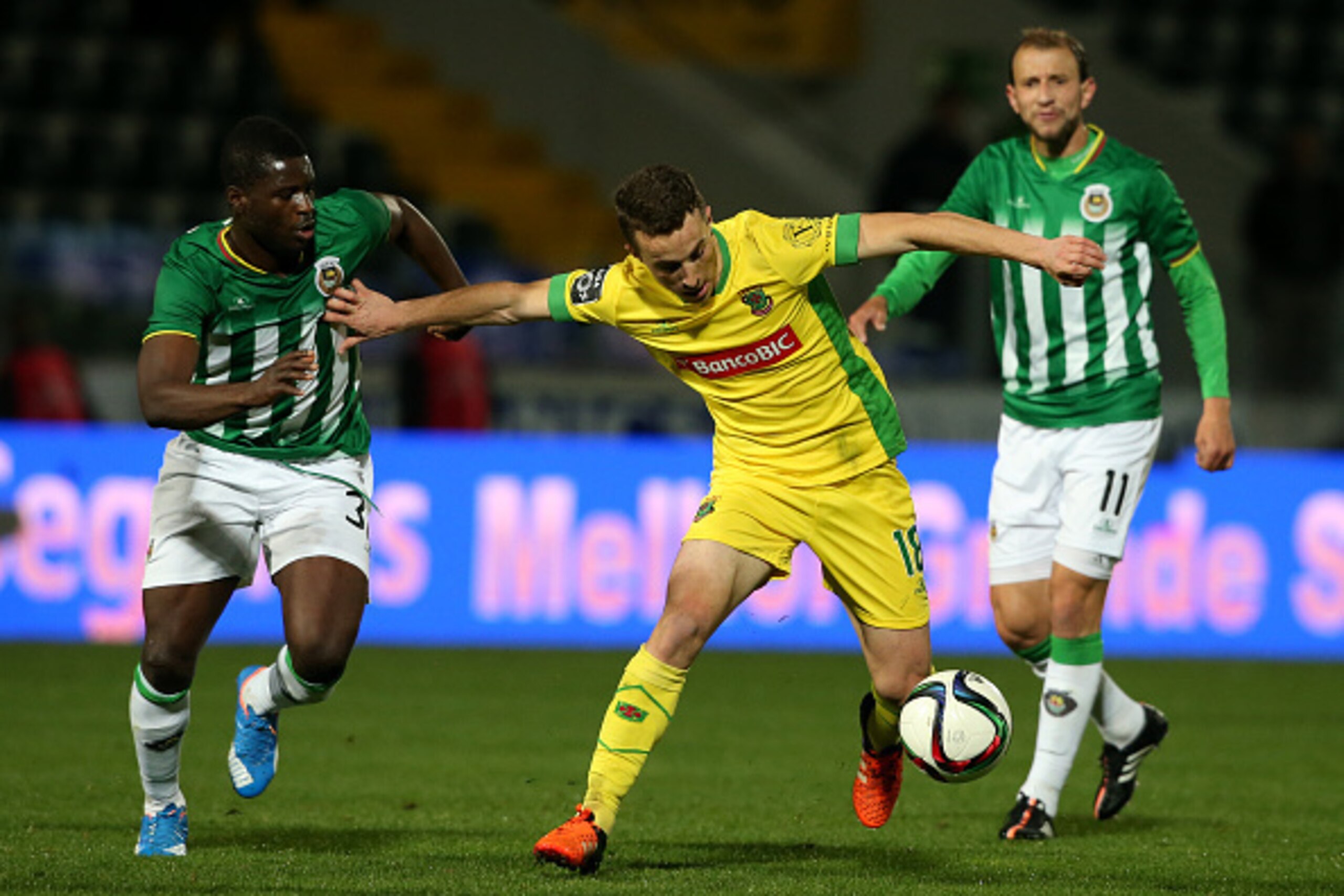 PACOS DE FERREIRA, PORTUGAL - NOVEMBER 22:  FC Pacos de Ferreira's midfielder Diogo Jota with Rio Ave FC's midfielder Alhassan Wakaso in action during the Taca de Portugal match between FC Pacos de Ferreira and Rio Ave FC at Estadio da Mata Real on Novemb
