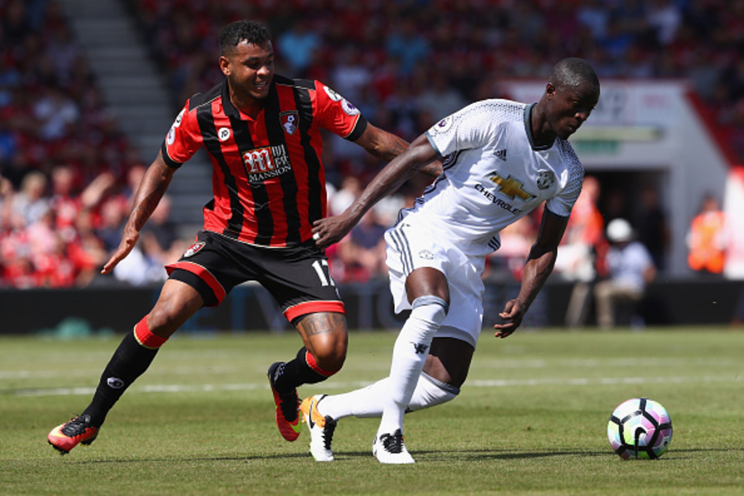 BOURNEMOUTH, ENGLAND - AUGUST 14: Eric Bailly (R) of Manchester United is tracked by Joshua King (L) of Bournemouth during the Premier League match between AFC Bournemouth and Manchester United at the Vitality Stadium on August 14, 2016 in Bournemouth, En