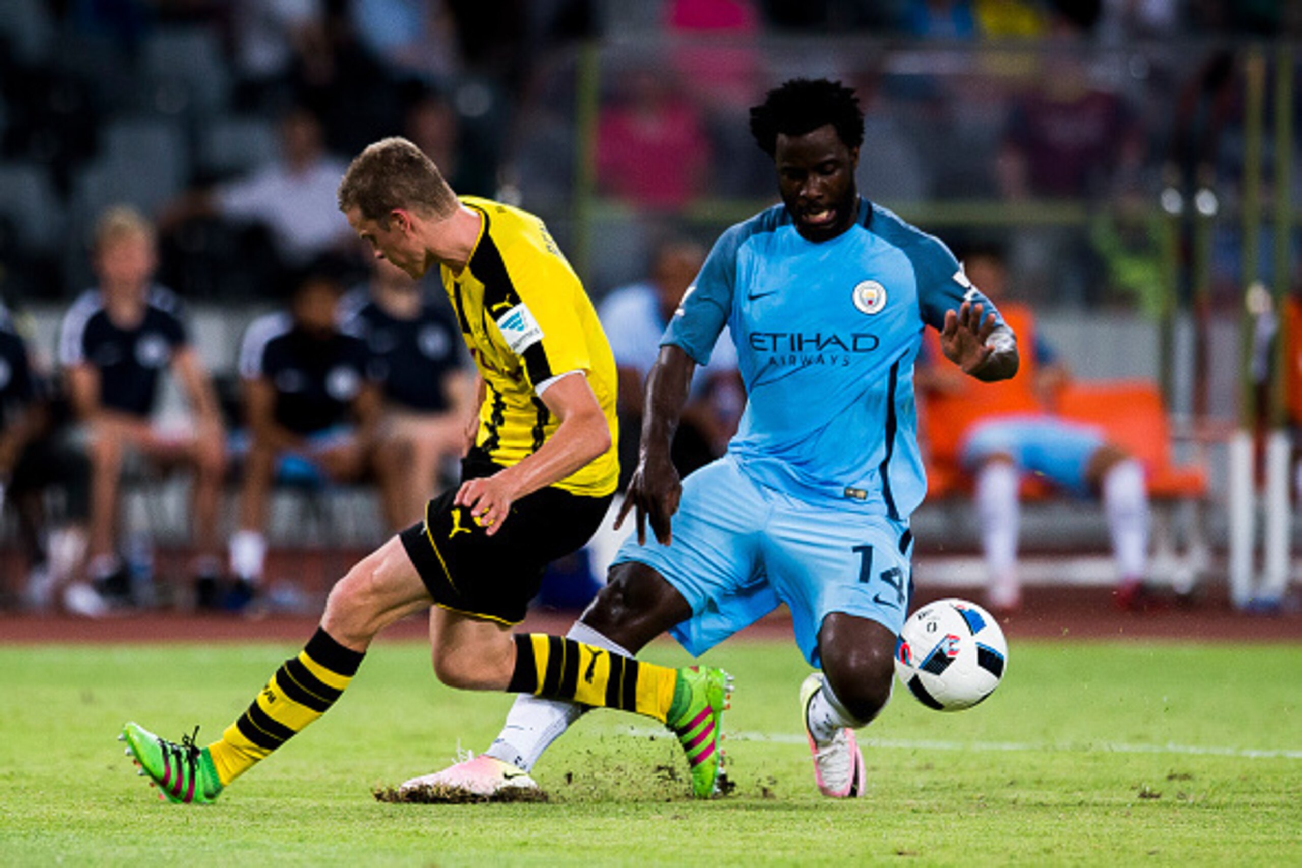 SHENZHEN - JULY 28: Manchester City striker Wilfried Bony (r) fights for the ball with Borussia Dortmund midfielder Sven Bender (l) during the match between Borussia Dortmund vs Manchester City FC at the 2016 International Champions Cup China match at the