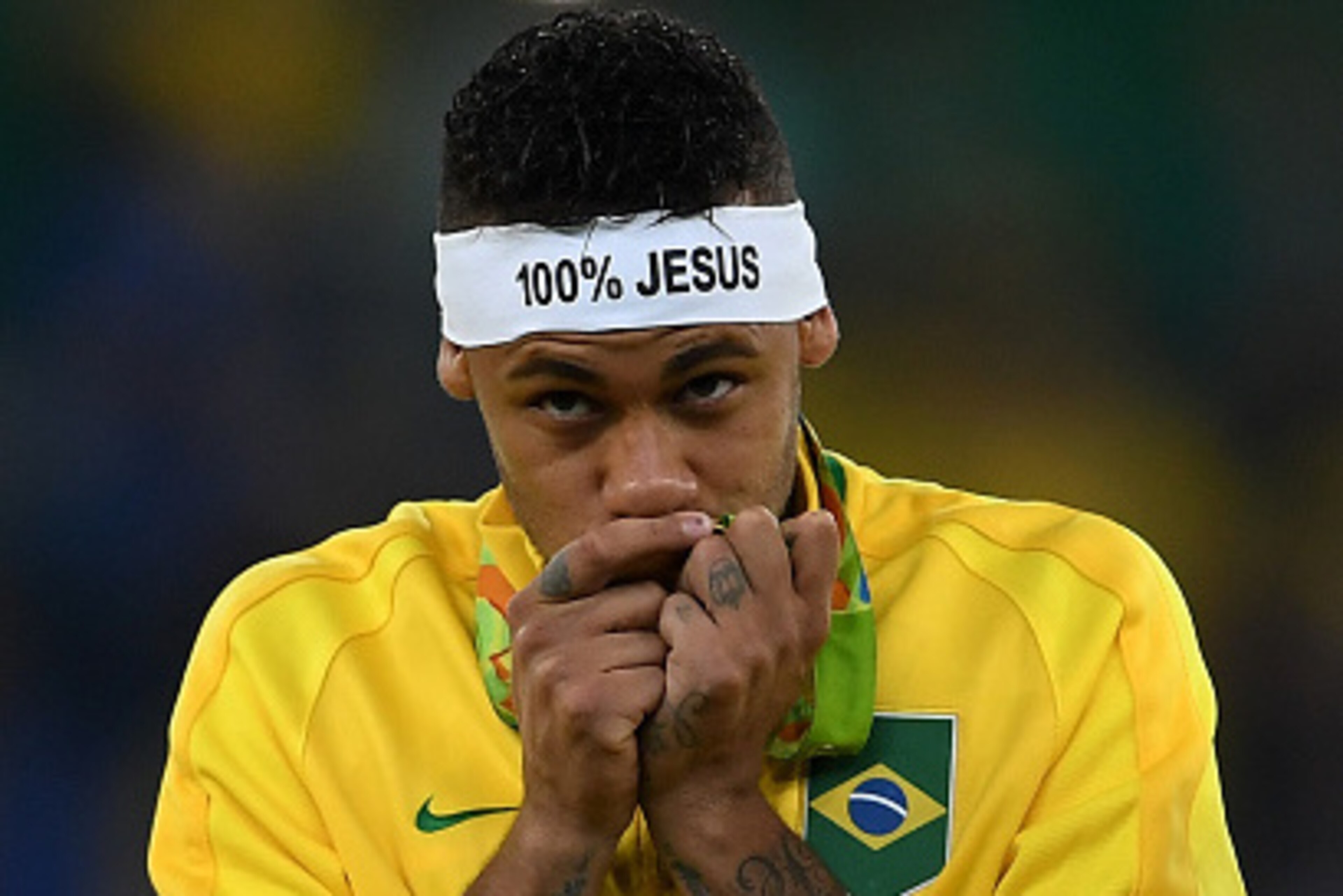 RIO DE JANEIRO, BRAZIL - AUGUST 20:  Neymar of Brazil celebrates with his gold medal after the Men's Football Final between Brazil and Germany at the Maracana Stadium on Day 15 of the Rio 2016 Olympic Games on August 20, 2016 in Rio de Janeiro, Brazil.  (