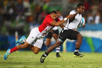RIO DE JANEIRO, BRAZIL - AUGUST 11:  Leone Nakarawa of Fiji is tackled by Dan Norton of Great Britain during the Men's Rugby Sevens Gold medal final match between Fiji and Great Britain on Day 6 of the Rio 2016 Olympics at Deodoro Stadium on August 11, 20
