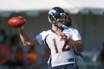Jul 28, 2016; Englewood, CO, USA; Denver Broncos quarterback Paxton Lynch (12) warms up before th start of training camp drills held at the UCHealth Training Center. Mandatory Credit: Ron Chenoy-USA TODAY Sports