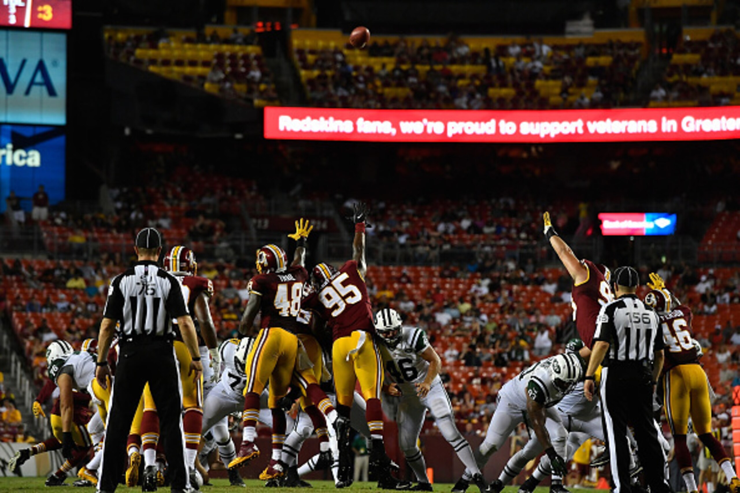 LANDOVER, MD - AUGUST 19:  Linebacker Lynden Trail #48 and defensive end Corey Crawford #95 of the Washington Redskins try to block an extra point during the game against the New York Jets at FedExField on August 19, 2016 in Landover, Maryland.  (Photo by
