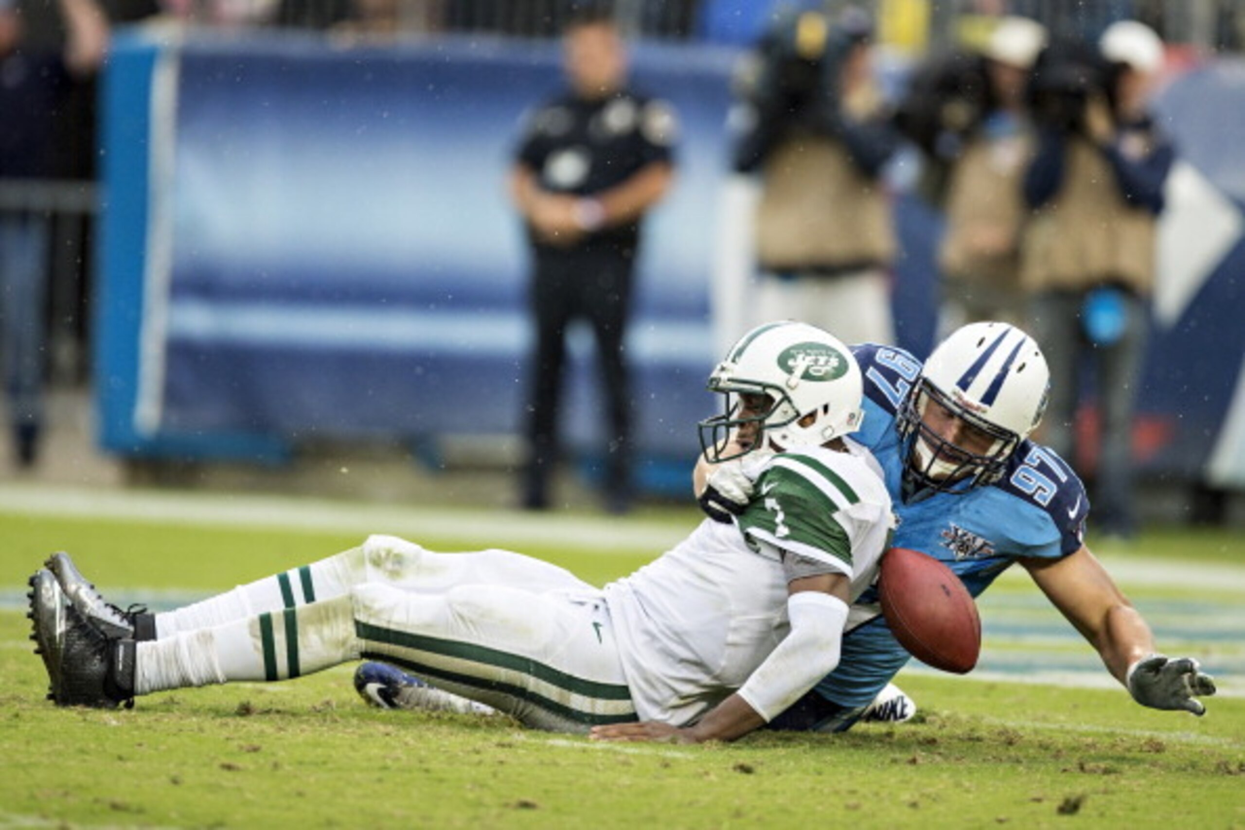 NASHVILLE, TN - SEPTEMBER 29: Geno Smith #7 of the New York Jets tries to get away from Karl Klug #97 of the Tennessee Titans and fumbles the football at LP Field on September 29, 2013 in Nashville, Tennessee. The Titans defeated the Jets 38-13. (Photo NASHVILLE, TN - SEPTEMBER 29: Geno Smith #7 of the New York Jets tries to get away from Karl Klug #97 of the Tennessee Titans and fumbles the football at LP Field on September 29, 2013 in Nashville, Tennessee. The Titans defeated the Jets 38-13. (Photo