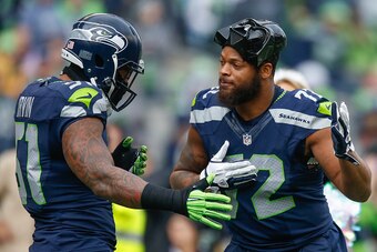 SEATTLE, WA - DECEMBER 20:  Defensive end Michael Bennett #72 (R) of the Seattle Seahawks sports a Darth Vader mask as he is greeted by linebacker Bruce Irvin #51 during introductions prior to the game against the Cleveland Browns at CenturyLink Field on 