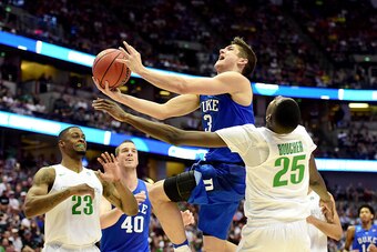 ANAHEIM, CA - MARCH 24:  Grayson Allen #3 of the Duke Blue Devils goes up for a shot against Chris Boucher #25 of the Oregon Ducks in the second half in the 2016 NCAA Men's Basketball Tournament West Regional at the Honda Center on March 24, 2016 in Anahe