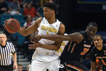 LAS VEGAS, NV - MARCH 10:  Jarmal Reid #32 of the Oregon State Beavers tries to steal the ball from Ivan Rabb #1 of the California Golden Bears during a quarterfinal game of the Pac-12 Basketball Tournament at MGM Grand Garden Arena on March 10, 2016 in L