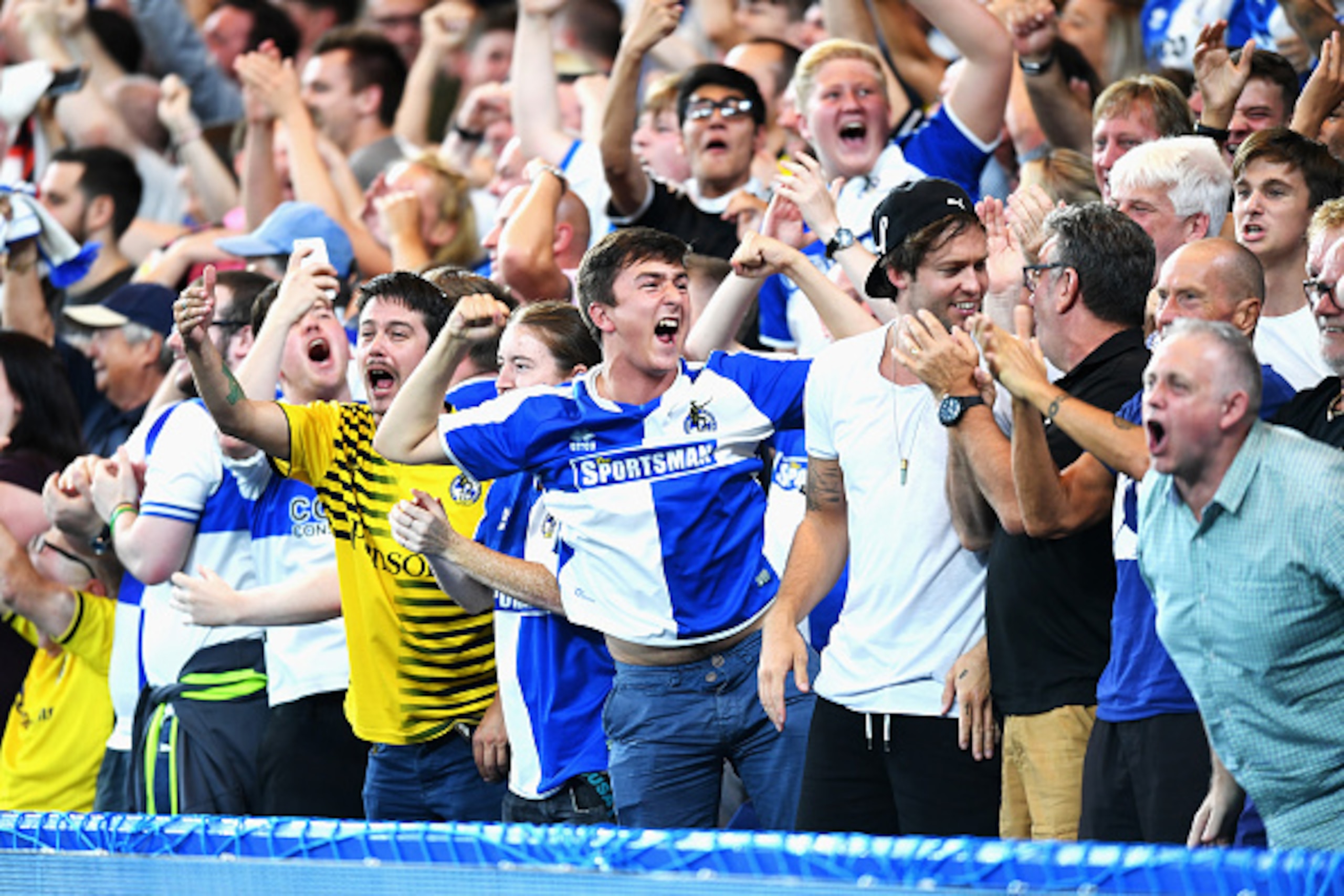 LONDON, ENGLAND - AUGUST 23:  Bristol Rovers fans celebrate the goal scored by Peter Hartley during the EFL Cup second round match between Chelsea and Bristol Rovers at Stamford Bridge on August 23, 2016 in London, England.  (Photo by Michael Regan/Getty 