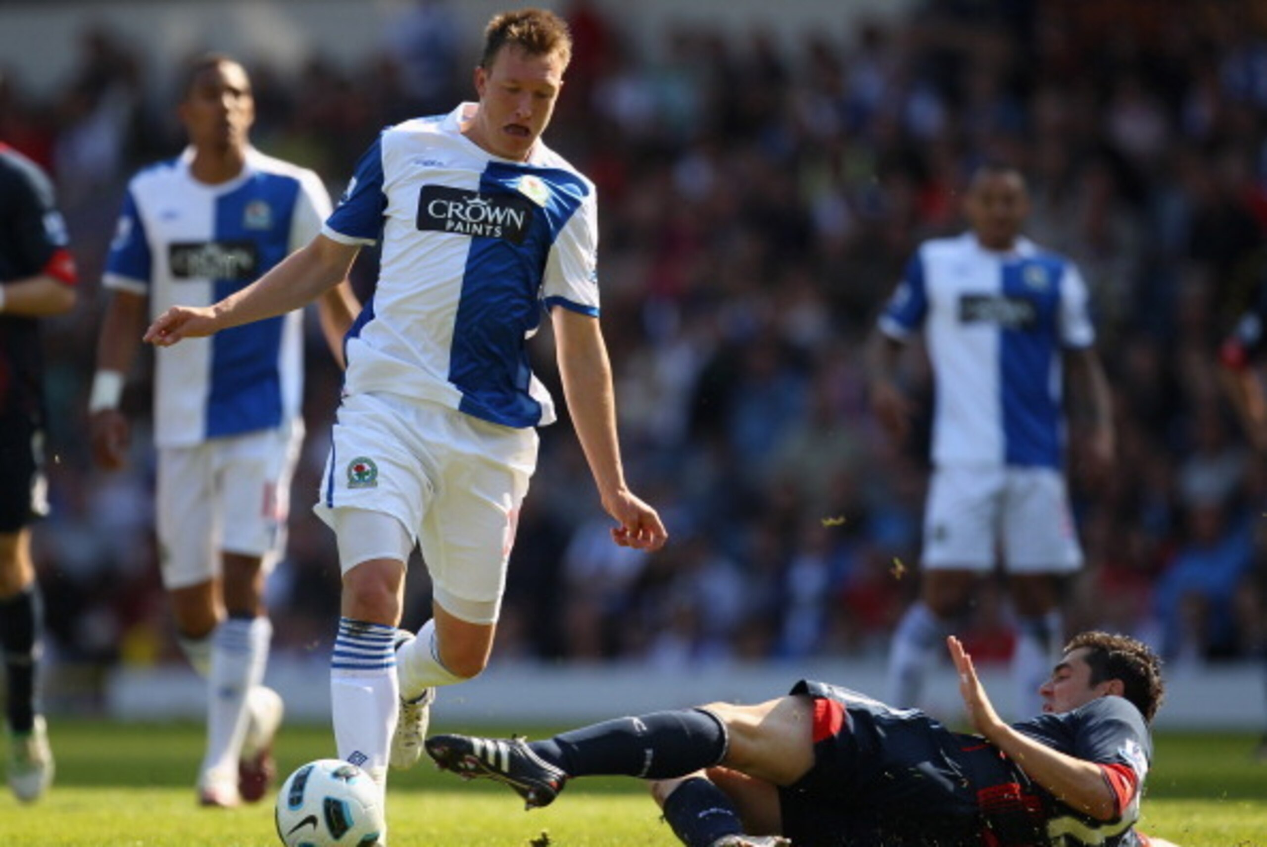 BLACKBURN, ENGLAND - APRIL 30:  Phil Jones of Blackburn Rovers is tackled by Tamir Cohen of Bolton Wanderers during the Barclays Premier League match between Blackburn Rovers and Bolton Wanderers at Ewood Park on April 30, 2011 in Blackburn, England.  (Ph