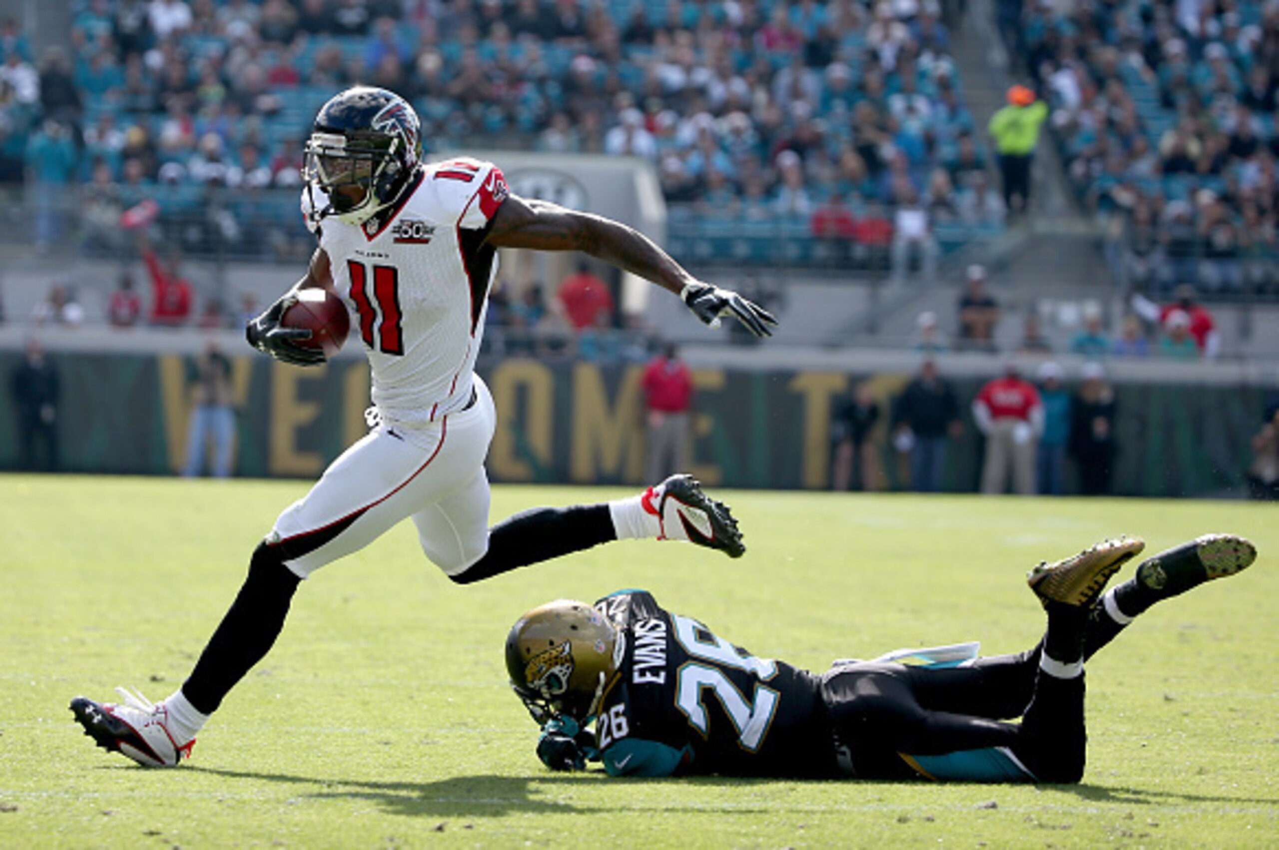JACKSONVILLE, FL - DECEMBER 20:   Julio Jones #11 of the Atlanta Falcons runs for yadage against Josh Evans #26 of the Jacksonville Jaguars at EverBank Field on December 20, 2015 in Jacksonville, Florida.  (Photo by Sam Greenwood/Getty Images)